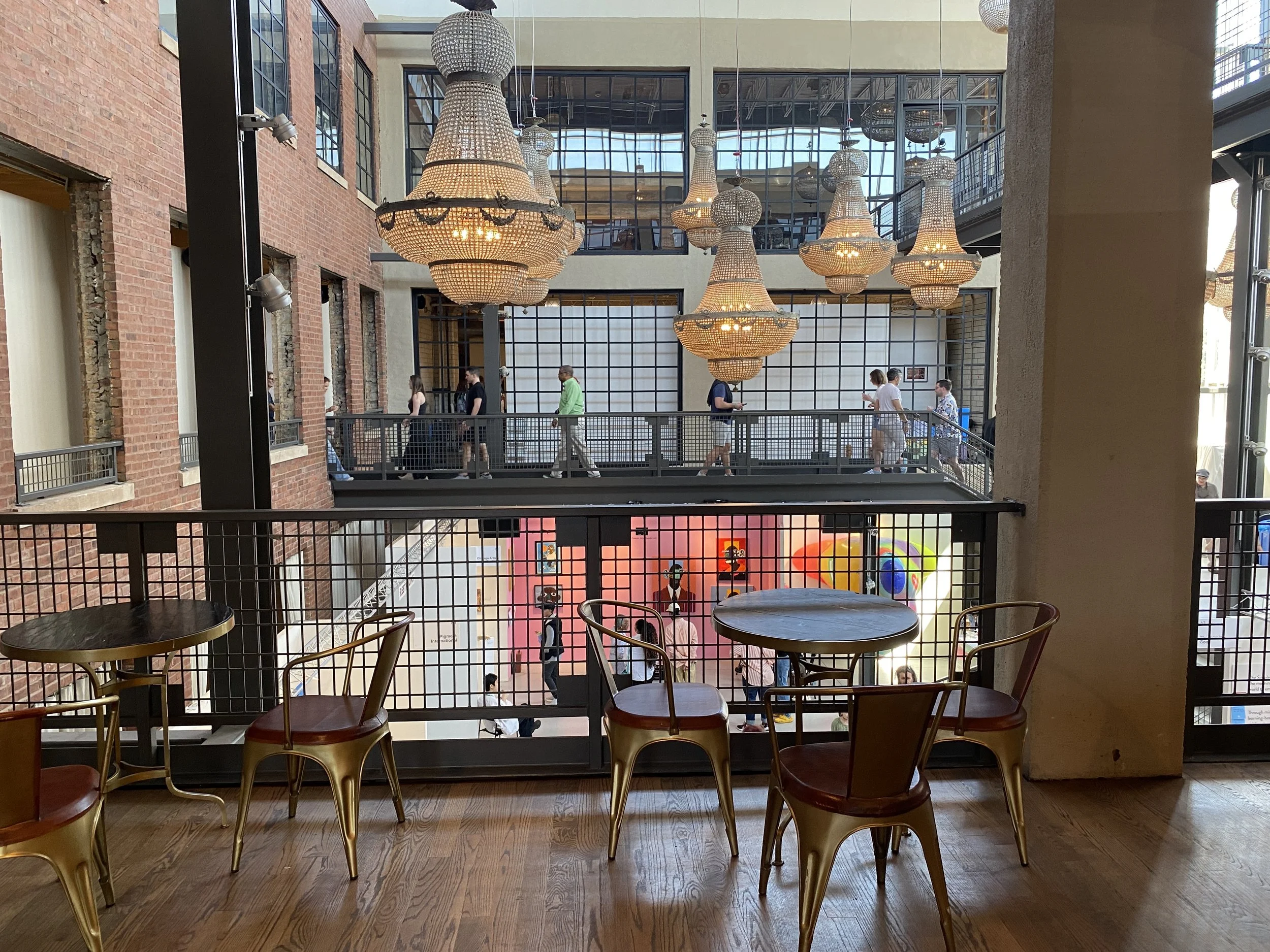 Tables, chairs and chandeliers in the bar area of Artifact Events during the Other Art Fair in Chicago