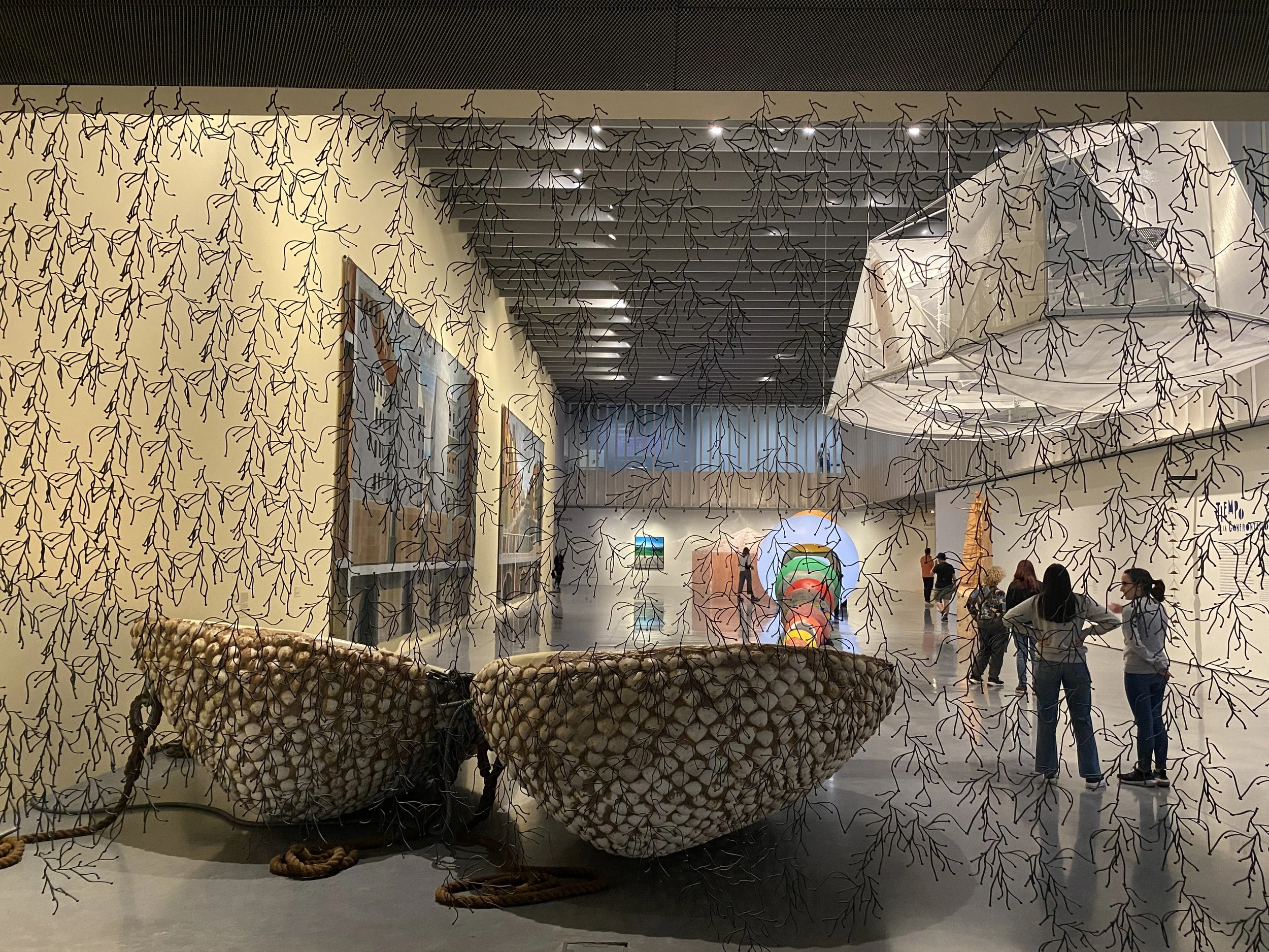 Modern art exhibits seen through a gauzy curtain at the Centre Pompidou Malaga