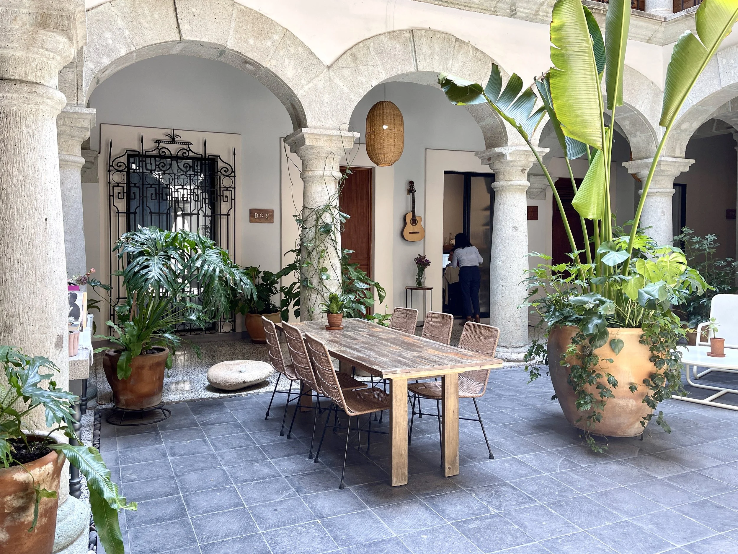 Table and plants in hotel that was once a convent
