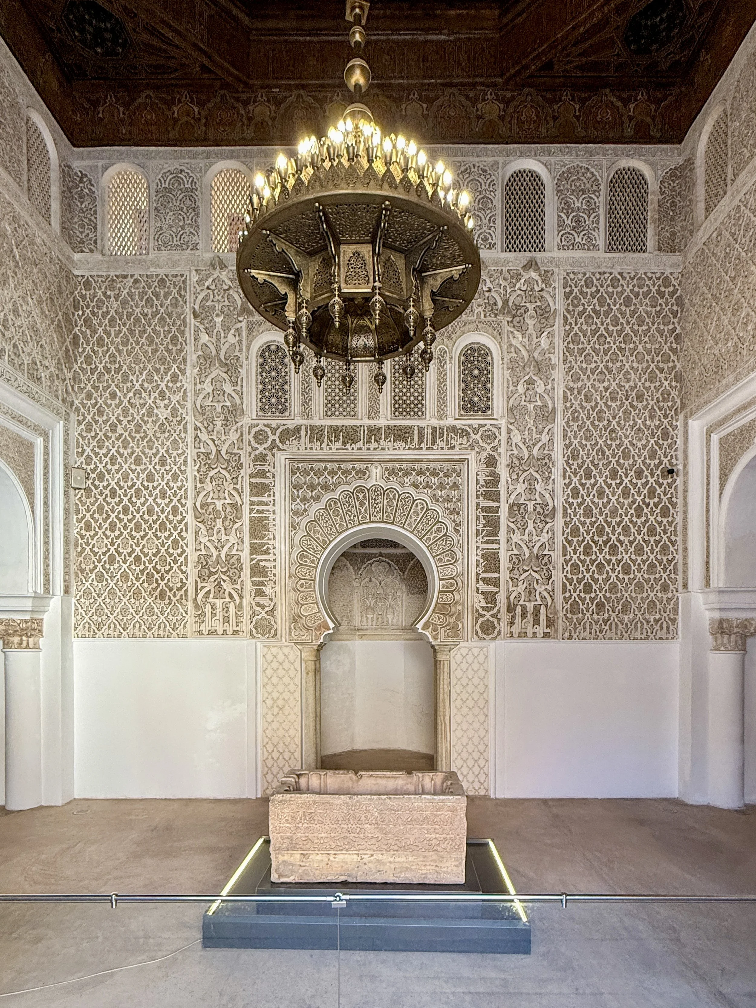 A chandelier hangs above the ablution basin in the Prayer Hall of Ben Youssef Madrasa