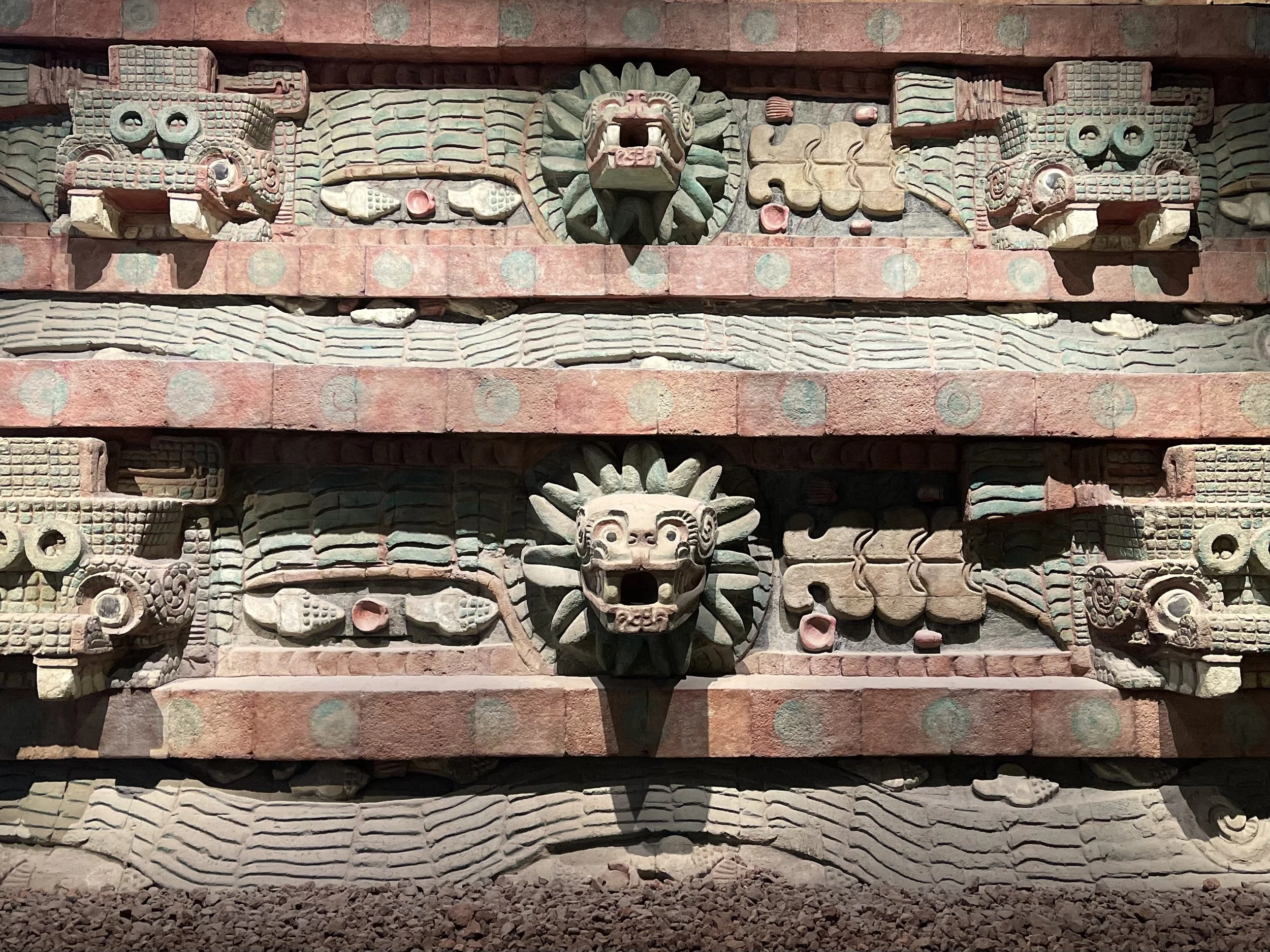 Animal heads and other carvings on parts of an Aztec temple in CDMX's Museo Nacional de Antropología