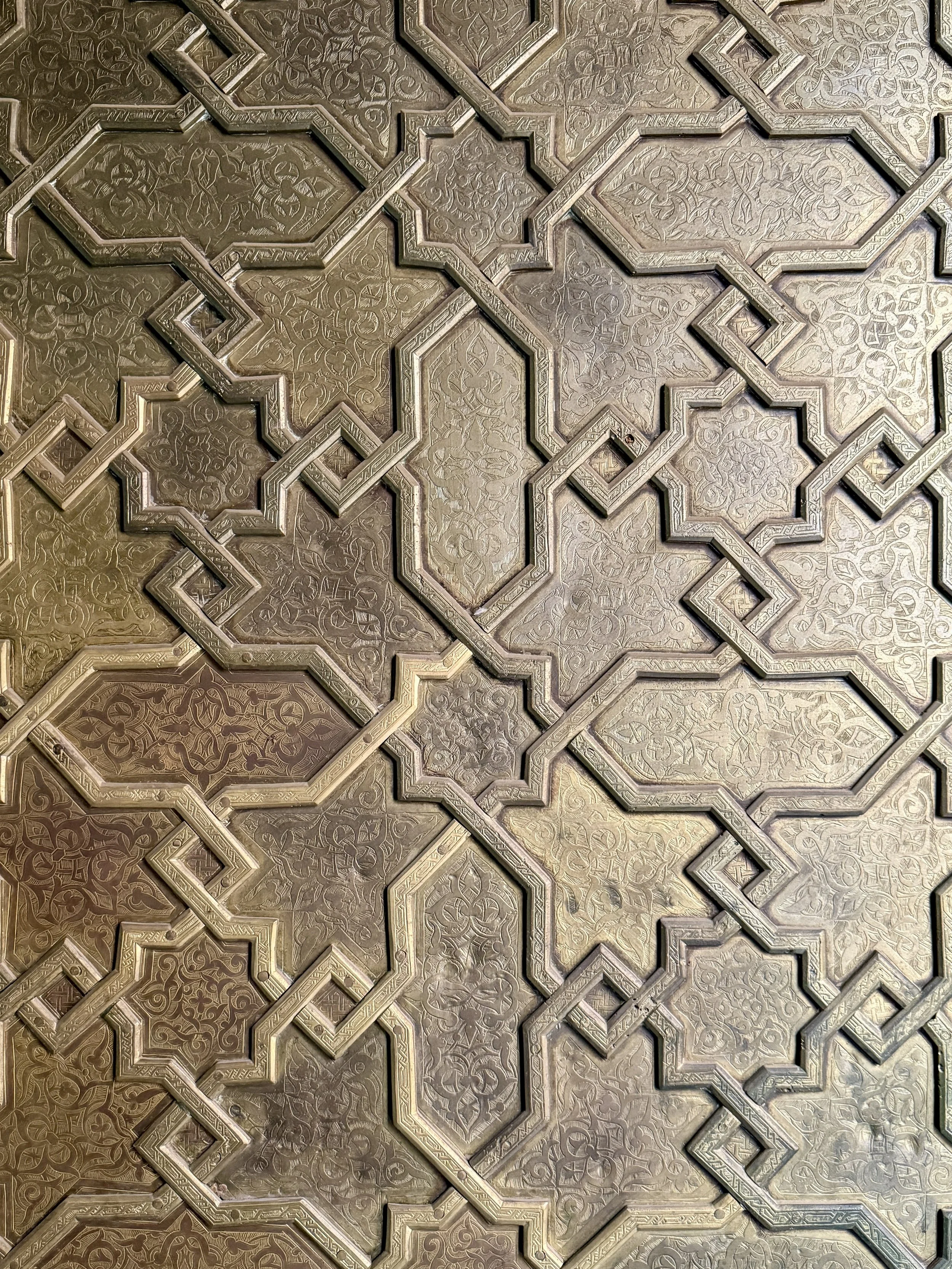 Starlike patterns carved on a wood door at Ben Youssef Madrasa