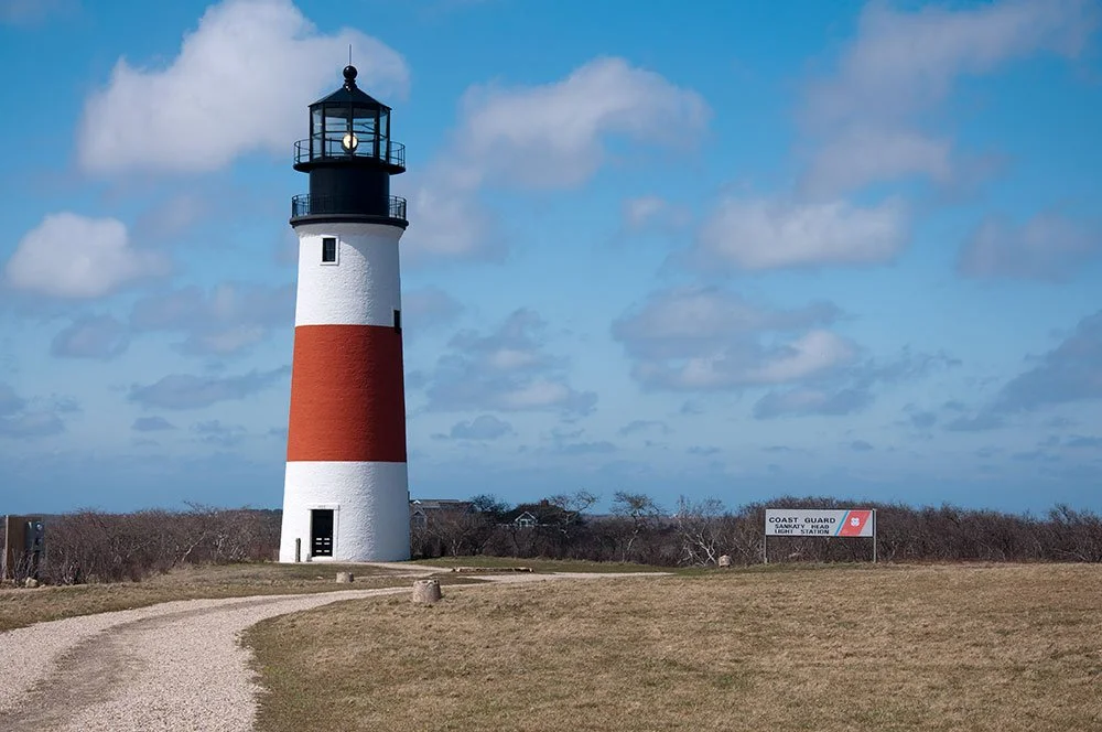 Red and white striped Sankaty Head Lighthouse in Nantucket