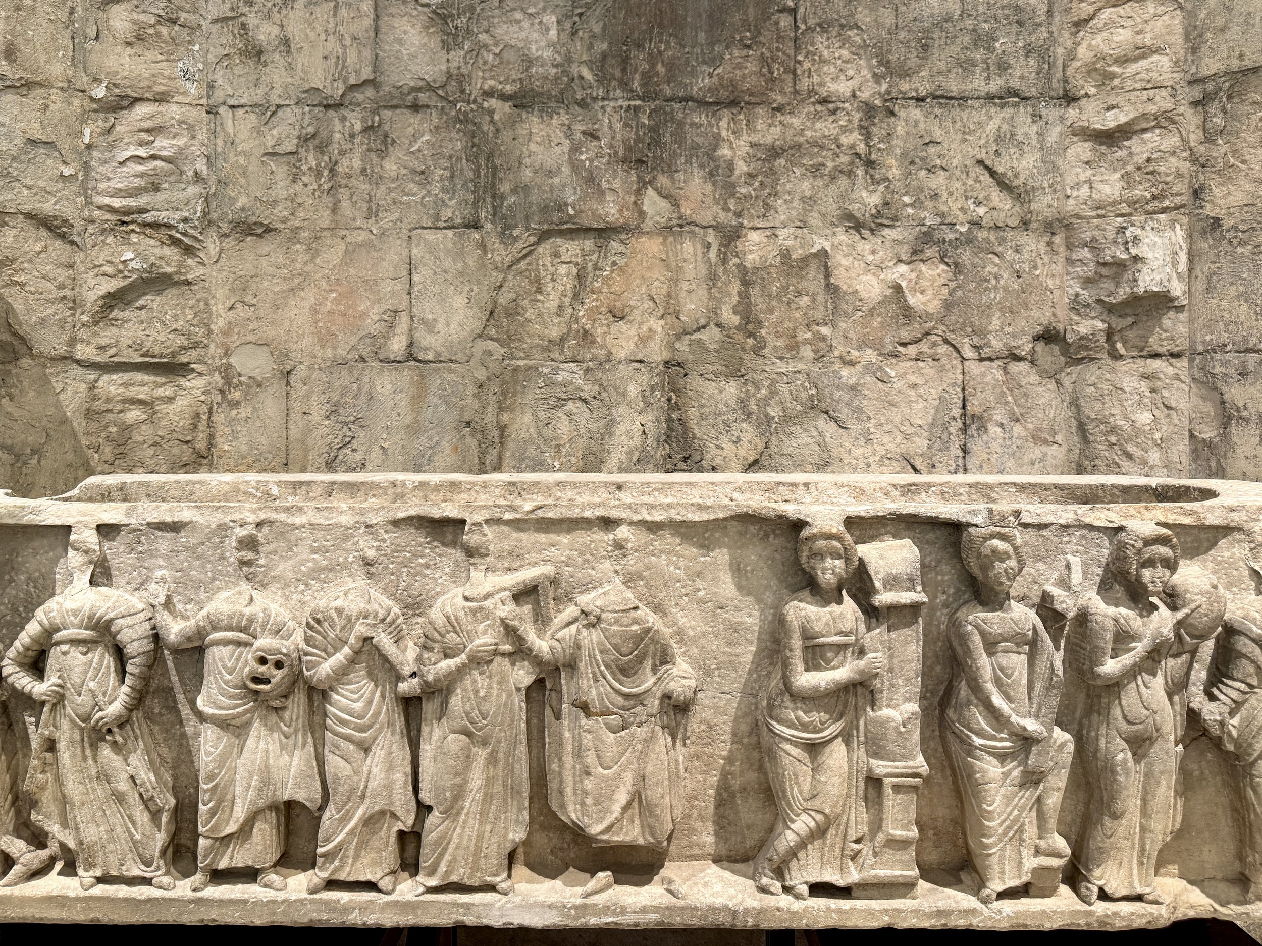 A marble sarcophagus depicting the deceased flanked by the Muses, at the Carmo Archeological Museum in Lisbon