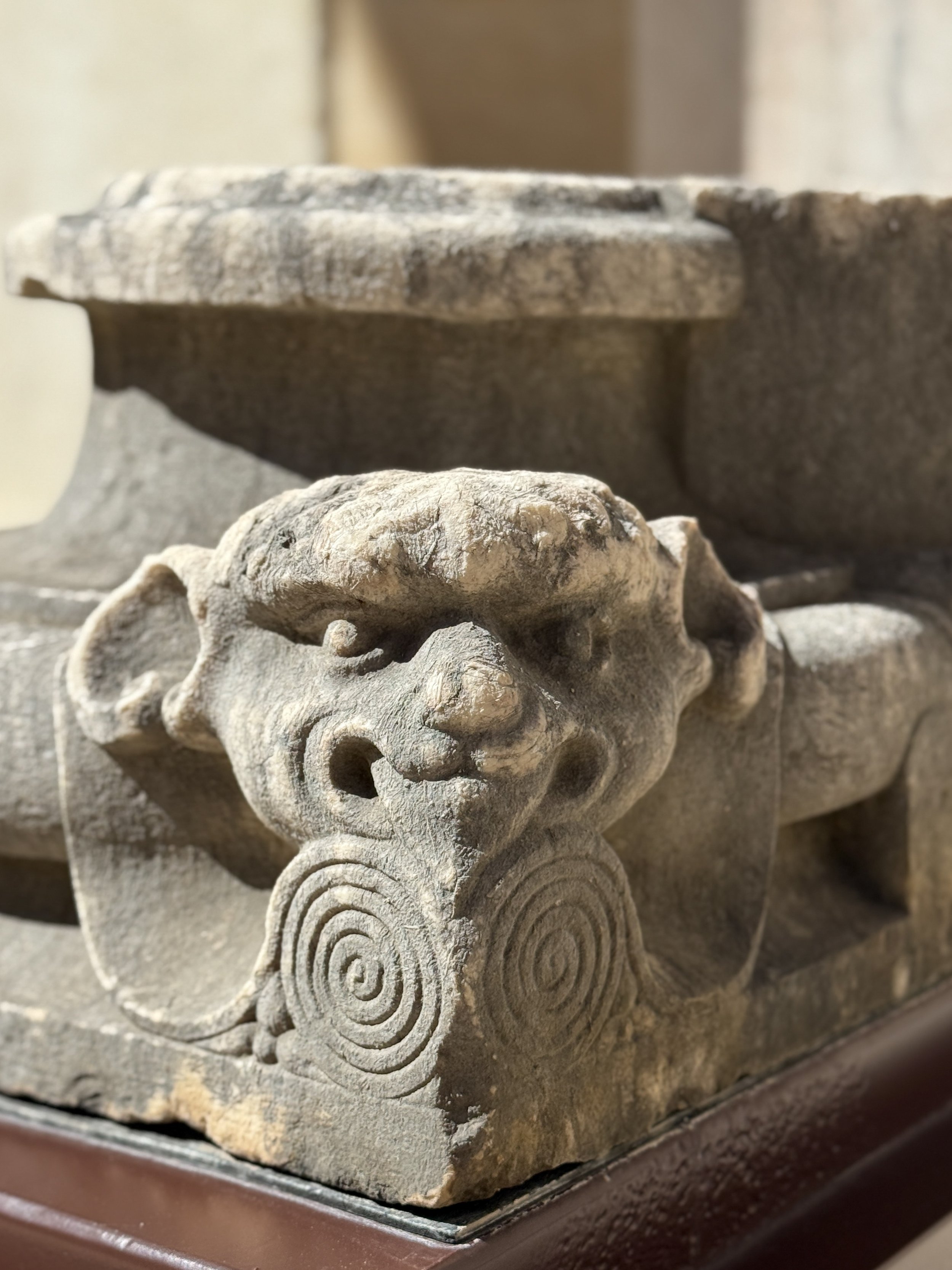 A weird little creature carved into a stone sarcophagus at the Carmo Archeological Museum in Lisbon
