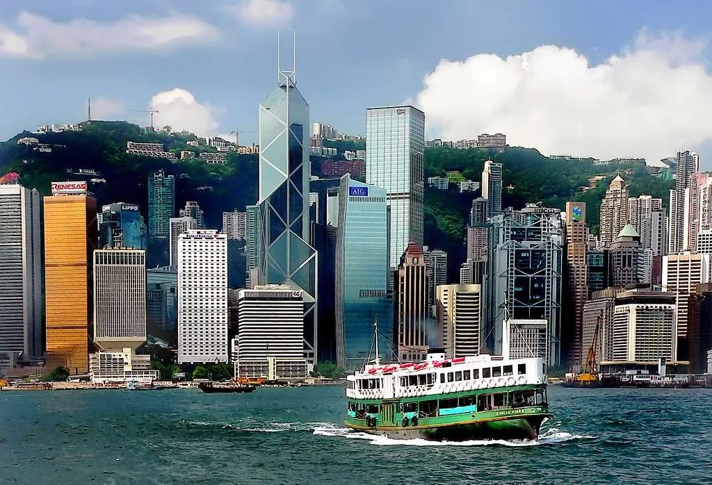 The Star Ferry cruises across Victoria Harbour in Hong Kong, past skyscrapers