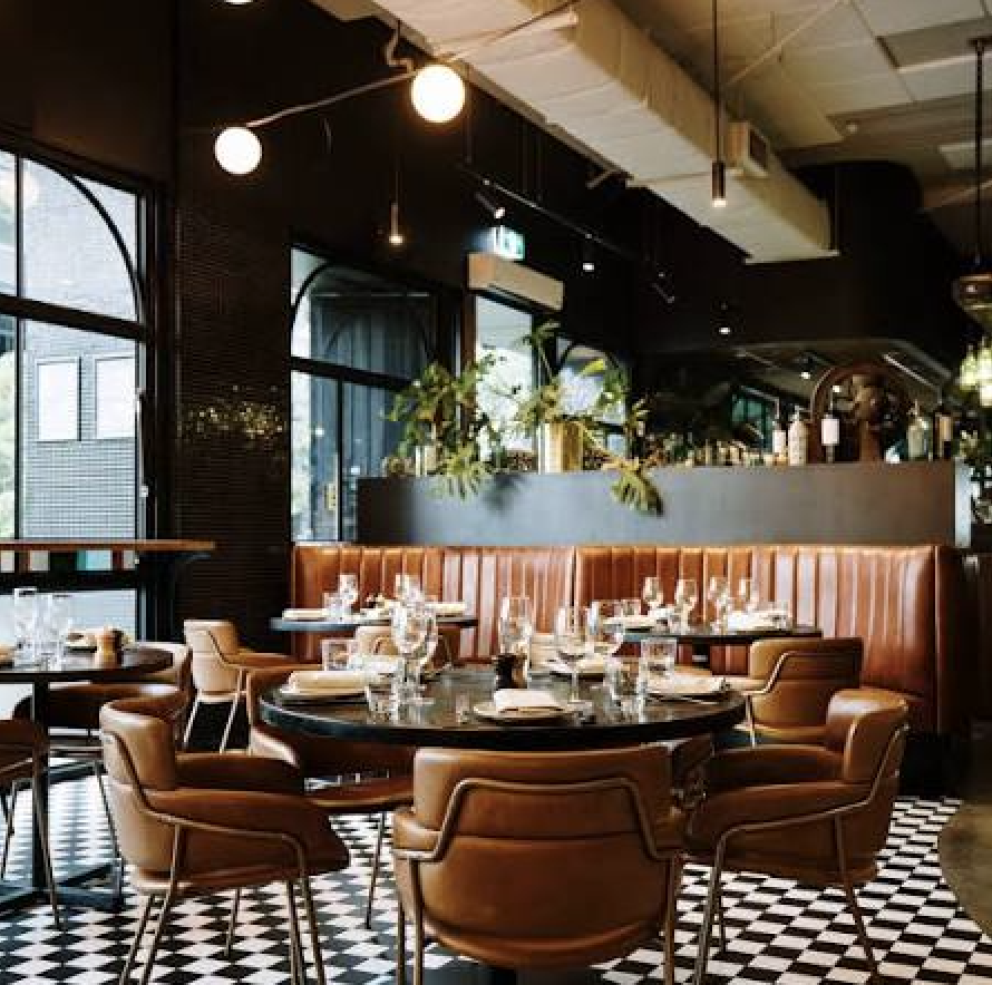 Black and white checkered floor and leather seating at Asado in Melbourne, Australia