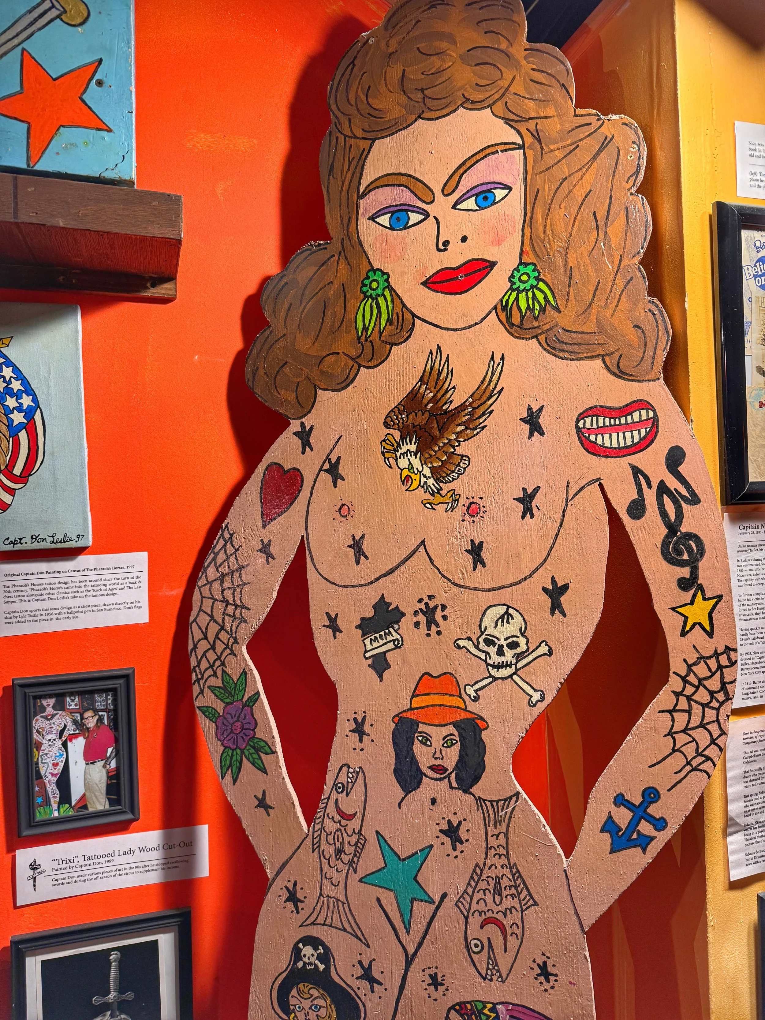Wooden cutout of a Tattooed Lady at the Graveface Museum in Savannah, Georgia