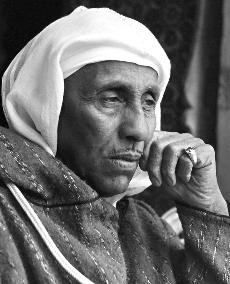 Thami El Glaoui, with a hand to his face