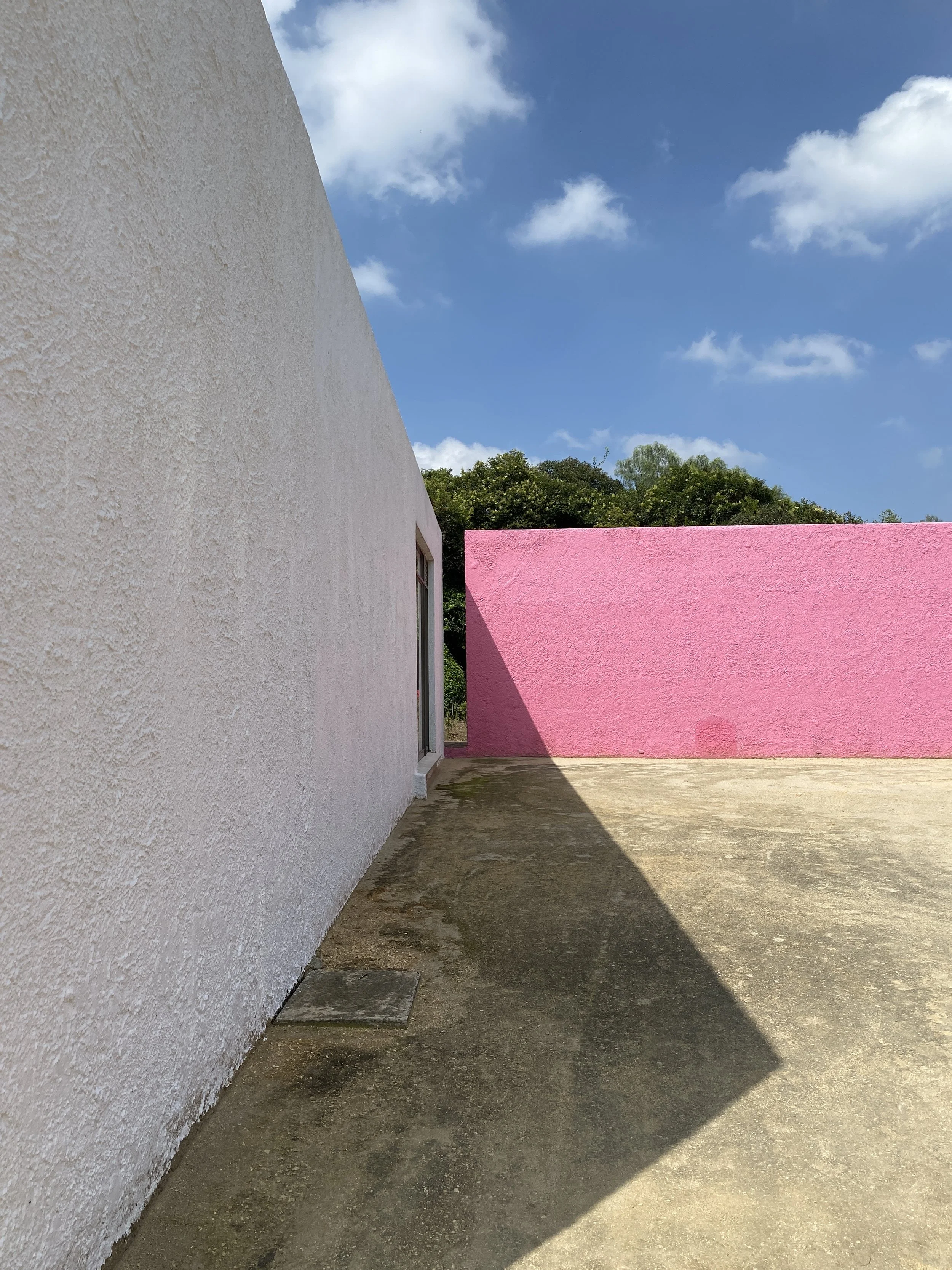 Back of house and pink garden wall at Cuadra San Cristobal