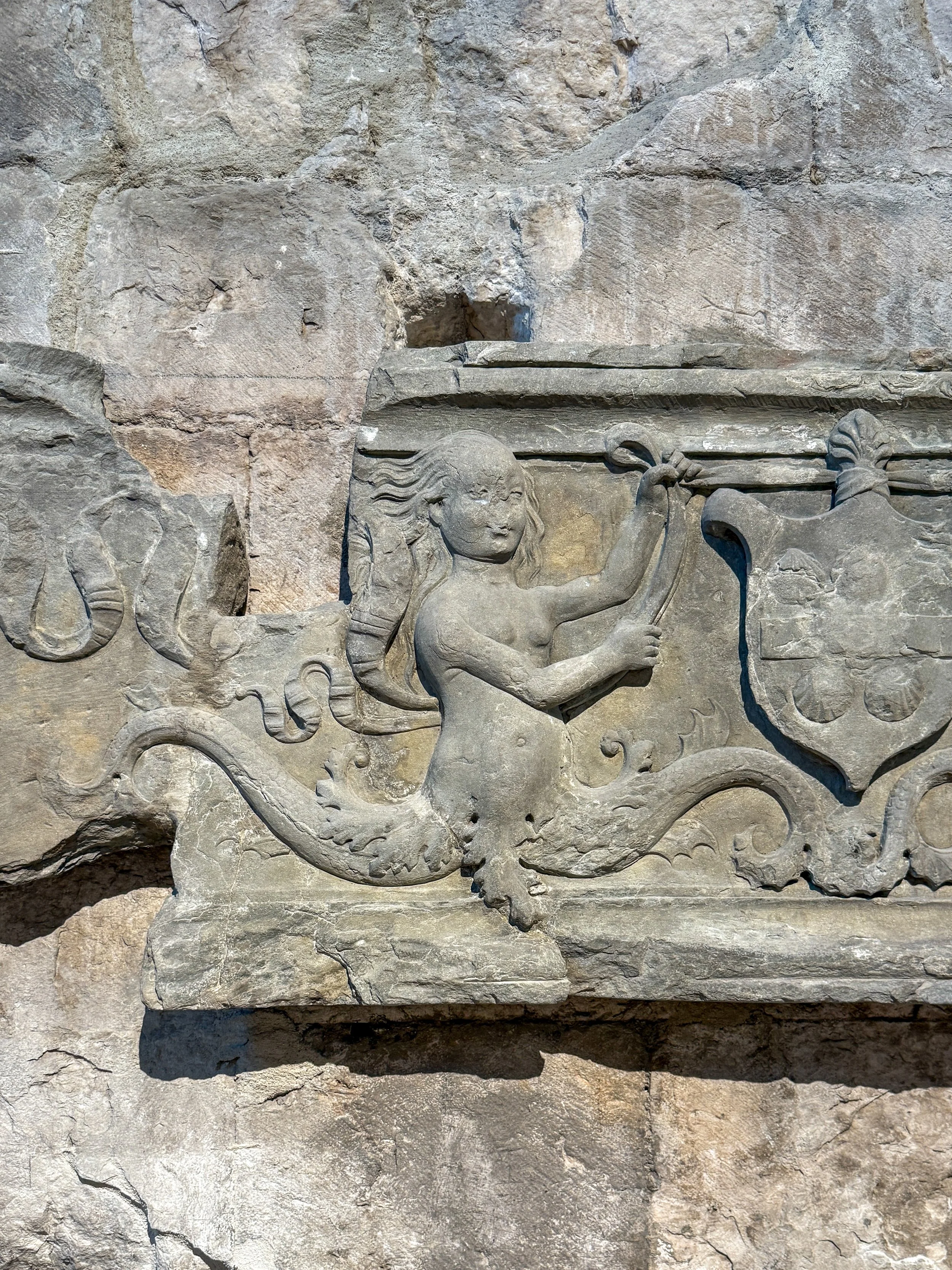 A two-tailed siren carved into a fragment of an altarpiece from the former Church of São Marcos, once located in Lisbon’s Campo das Cebolas