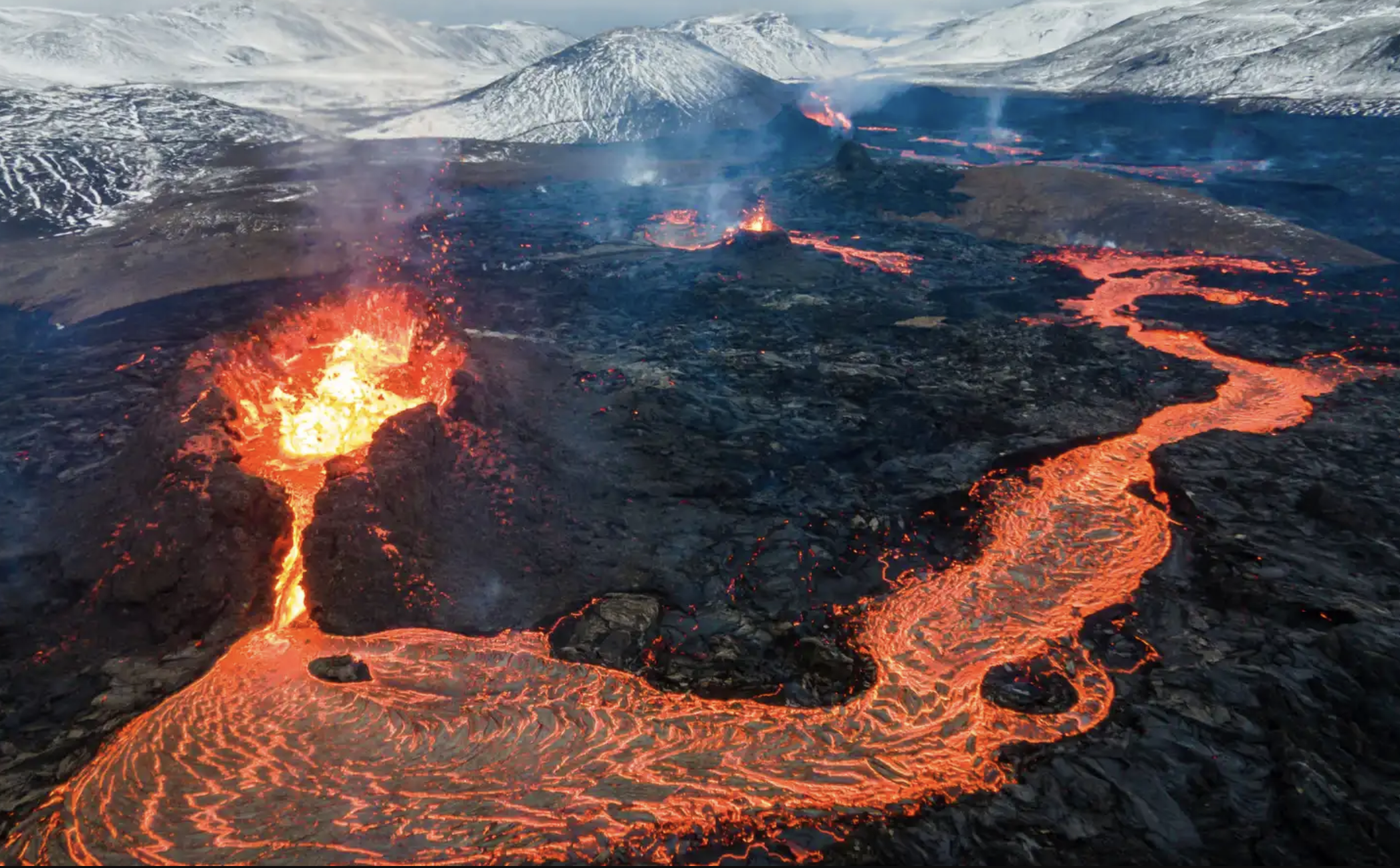 Fagradalsfjall volcano in Iceland with a big river of lava flowing out