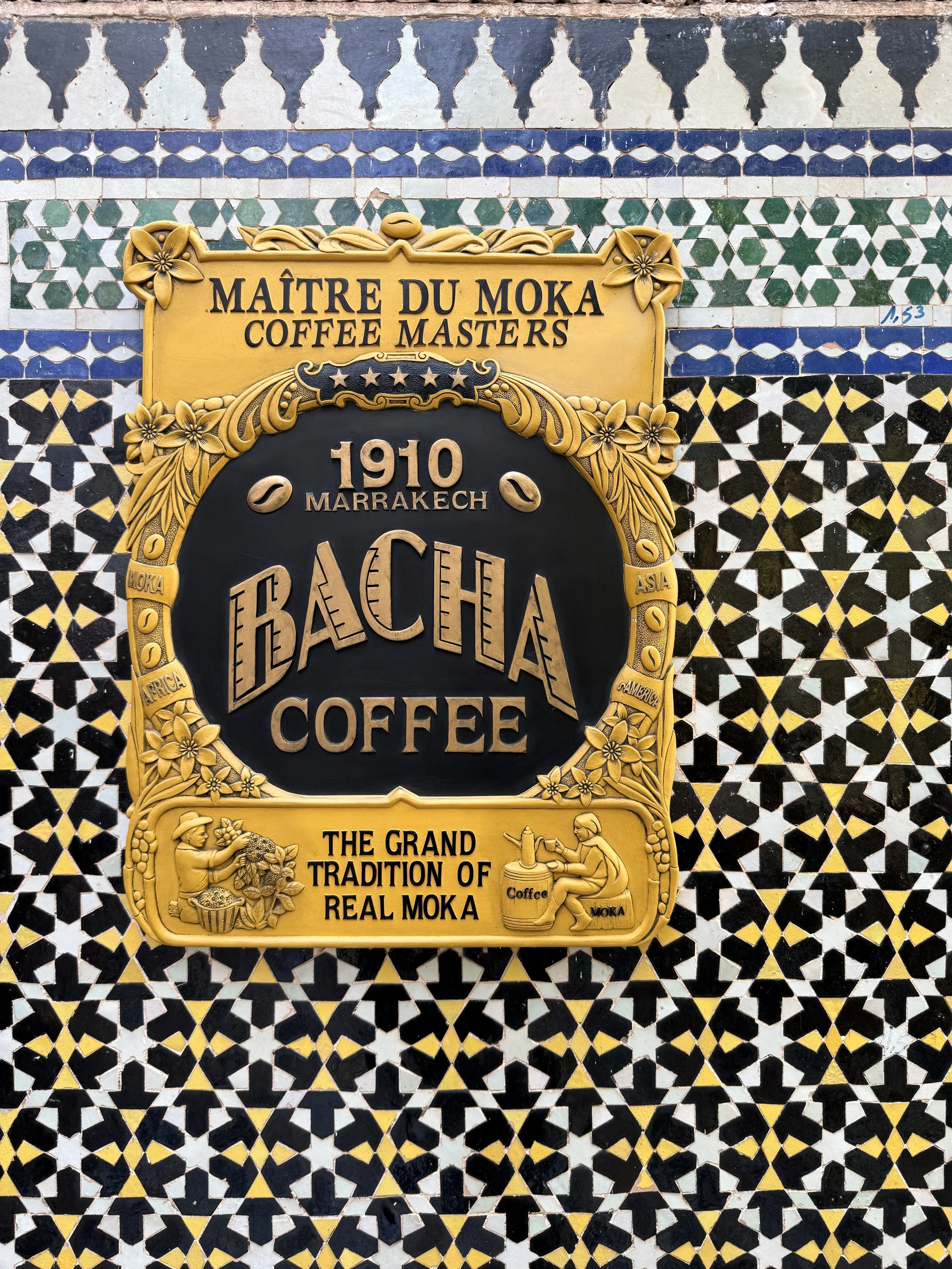 Sign for Bacha Coffee on tile wall at Dar el Bacha in Marrakech