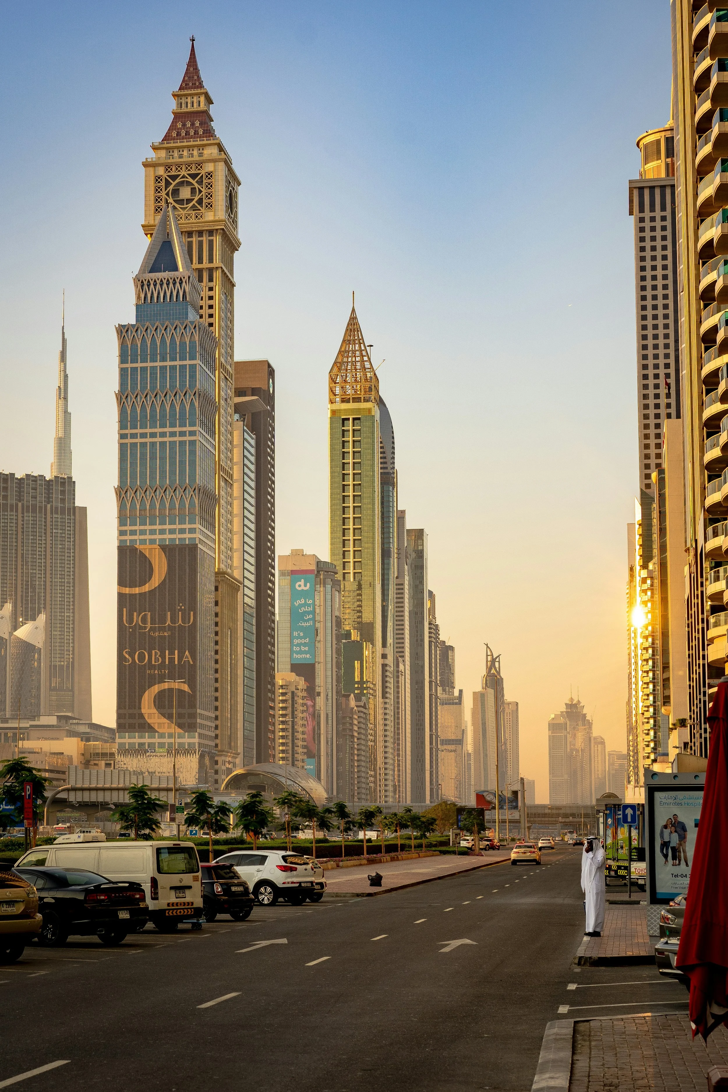 A street in Dubai running past a row of modern skyscrapers