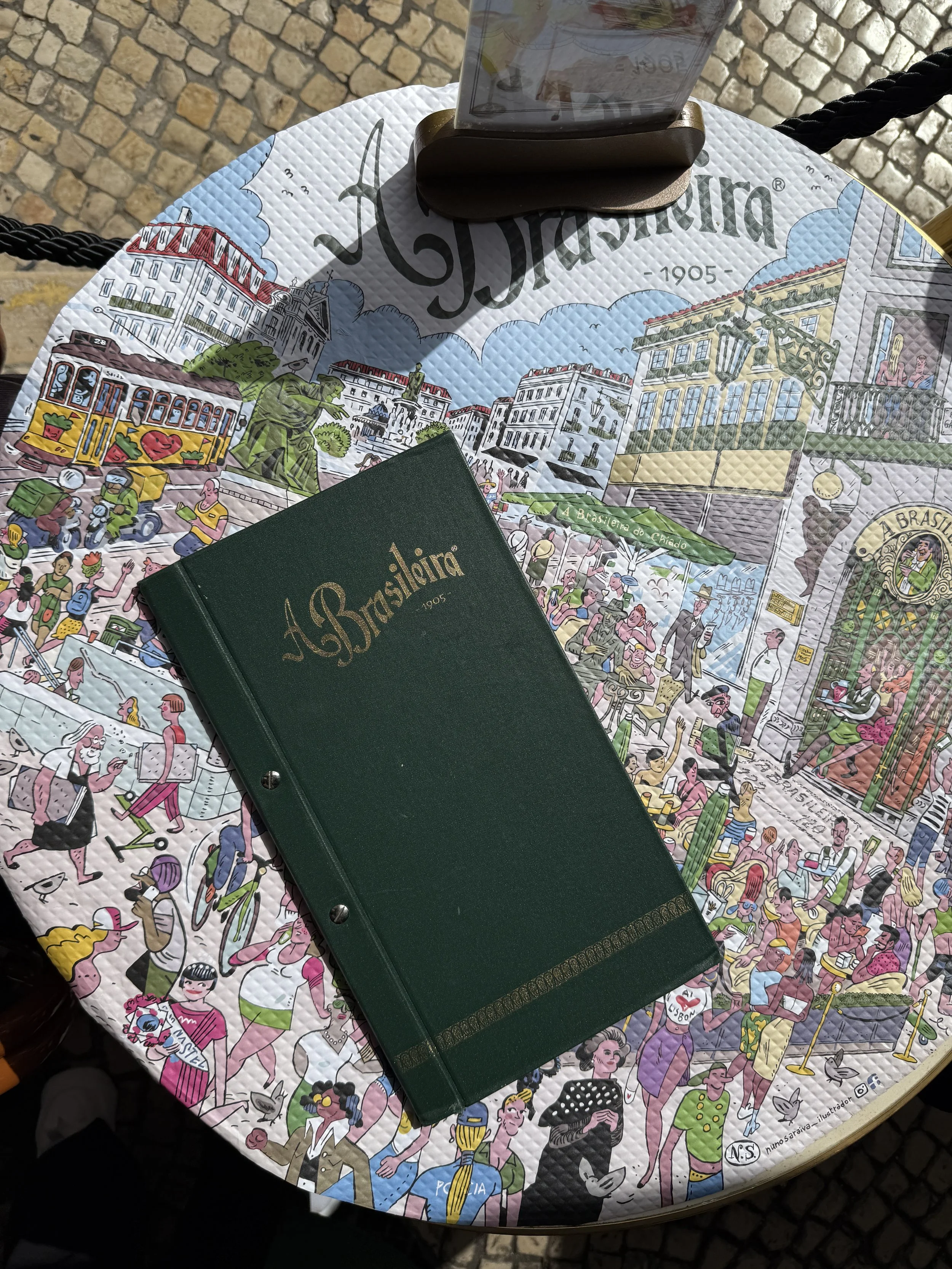 A menu and Nuno Saraiva’s illustrated tablecloths at A Brasileira