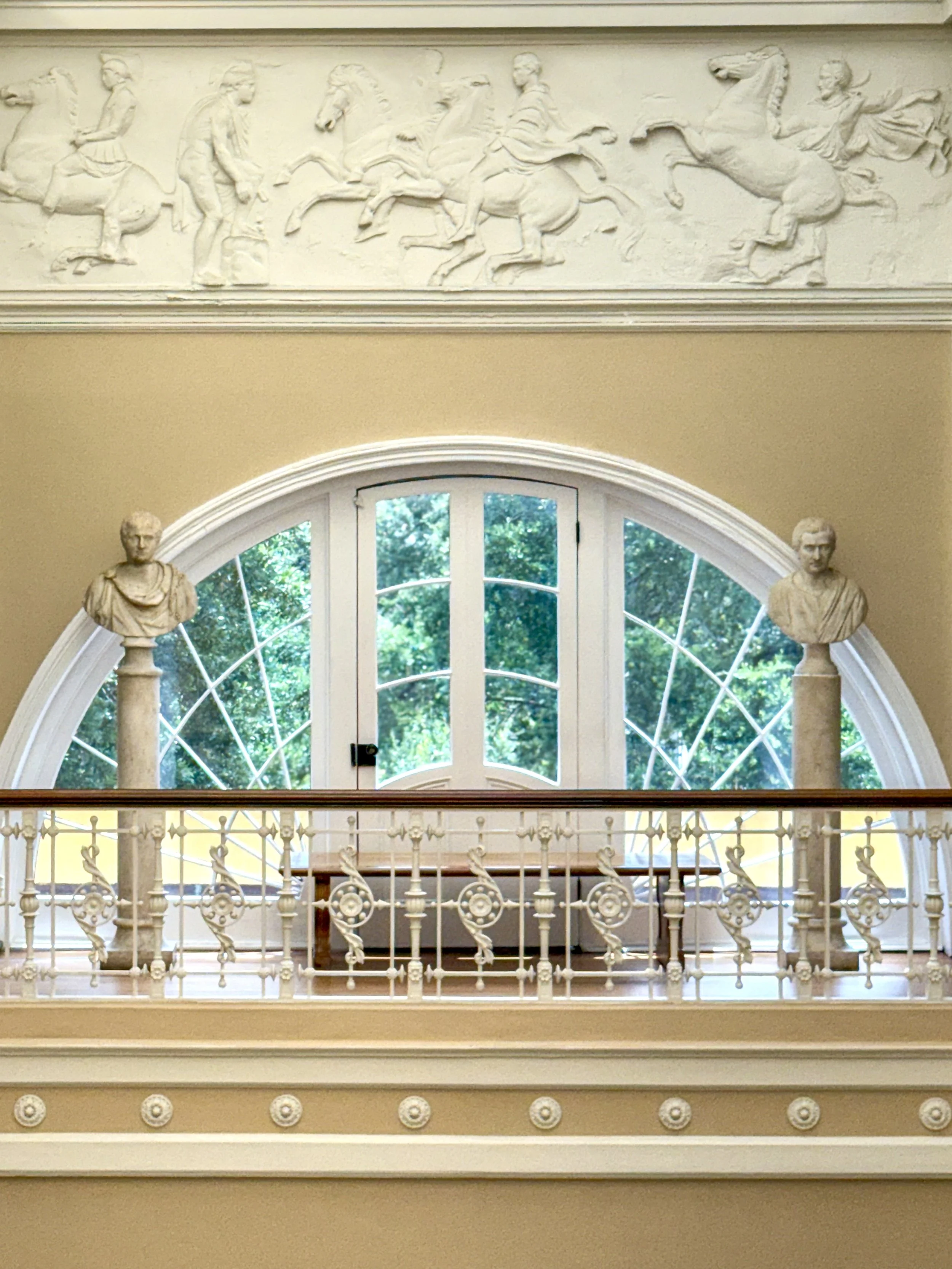 A view of the upper gallery of the Telfair Academy in Savannah, Georgia, with a plaster casting of part of the frieze from the Parthenon in Athens, Greece