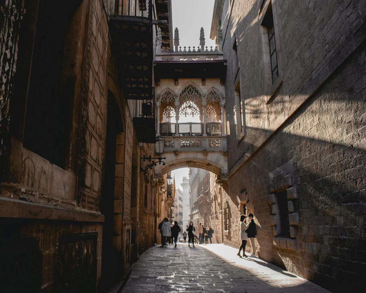 The small Bishop's Bridge in the dark quiet Gothic Quarter of Barcelona