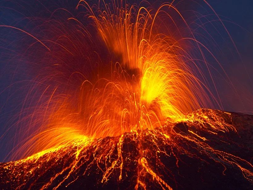 The volcano Stromboli off of Sicily, Italy erupts in arcs of flame and rivers of lava