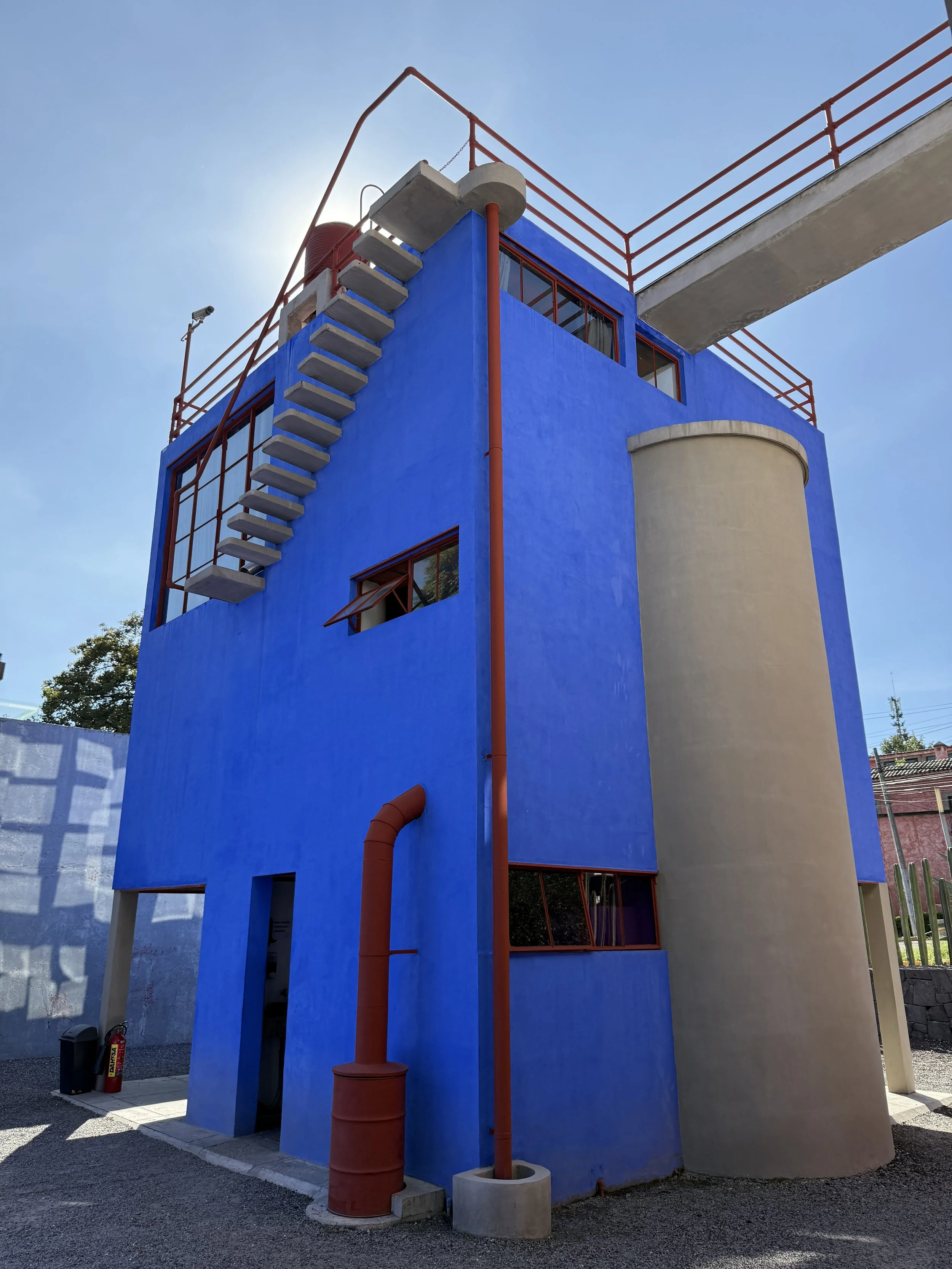 The floating exterior staircase and walkway at Frida's blue house at the Museo Casa Estudio Diego Rivera y Frida Kahlo, CDMX