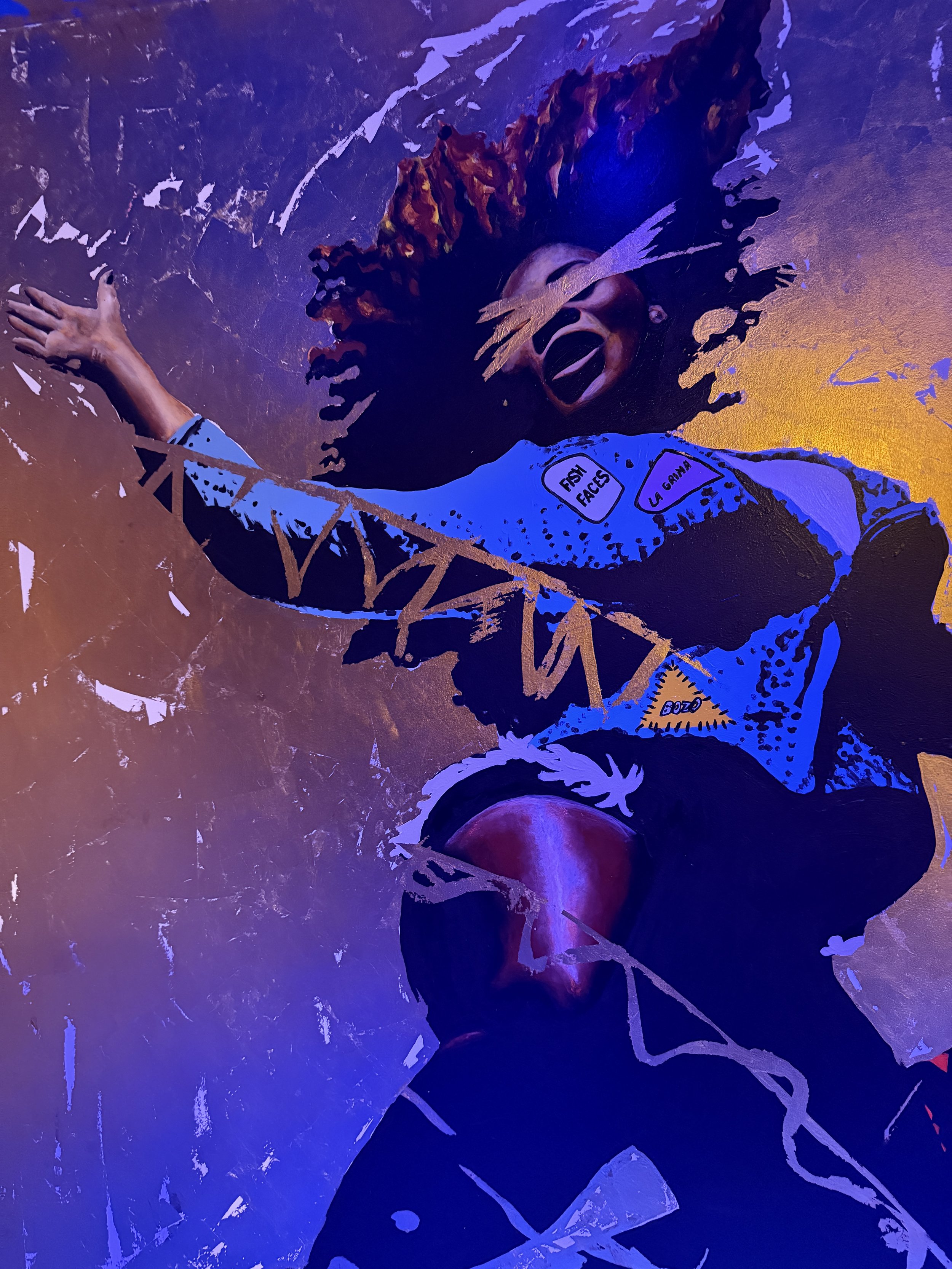 Artwork of dancing woman with eyes crossed out at Meow Wolf Radio Tave in Houston, Texas