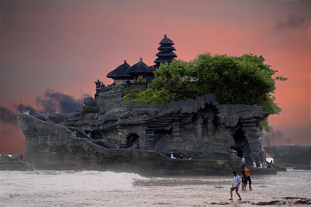 Balinese temple on rocky outcropping on beach