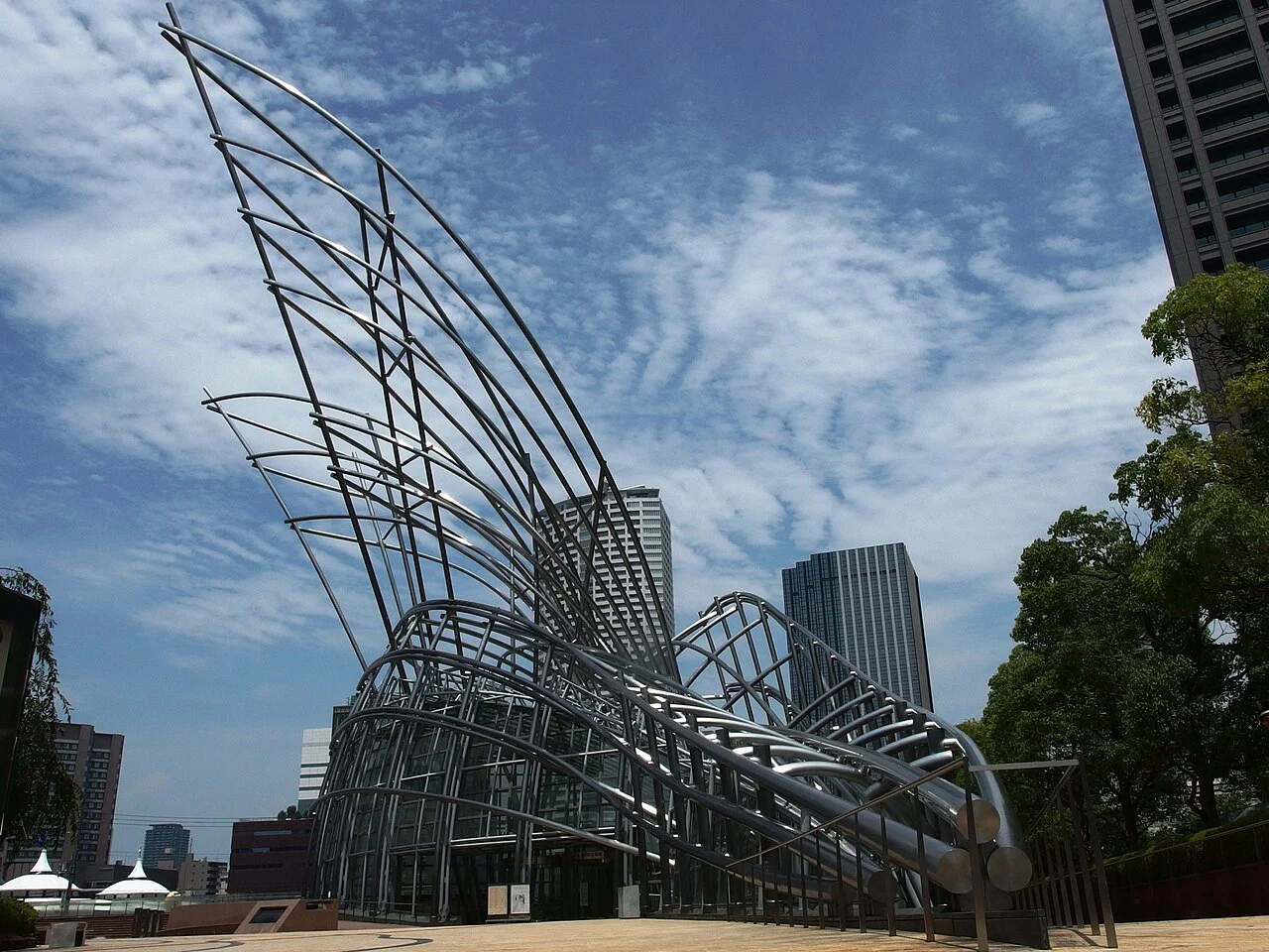 A metal sculpture in front of the Osaka National Museum of Art