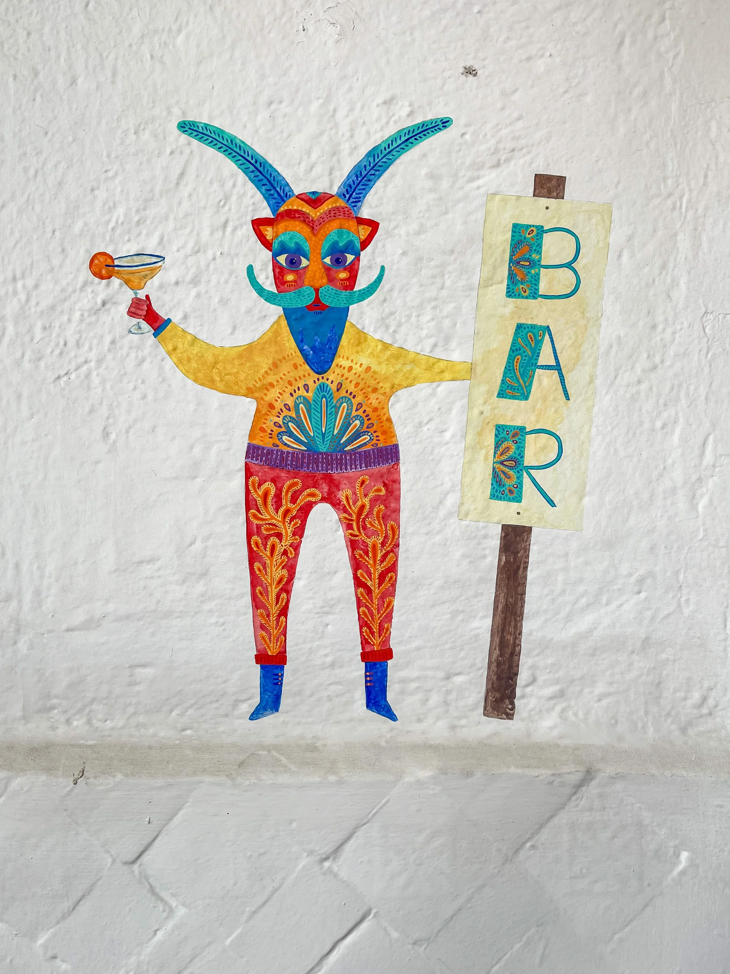 Sign that says "Bar" with monster drinking a margarita