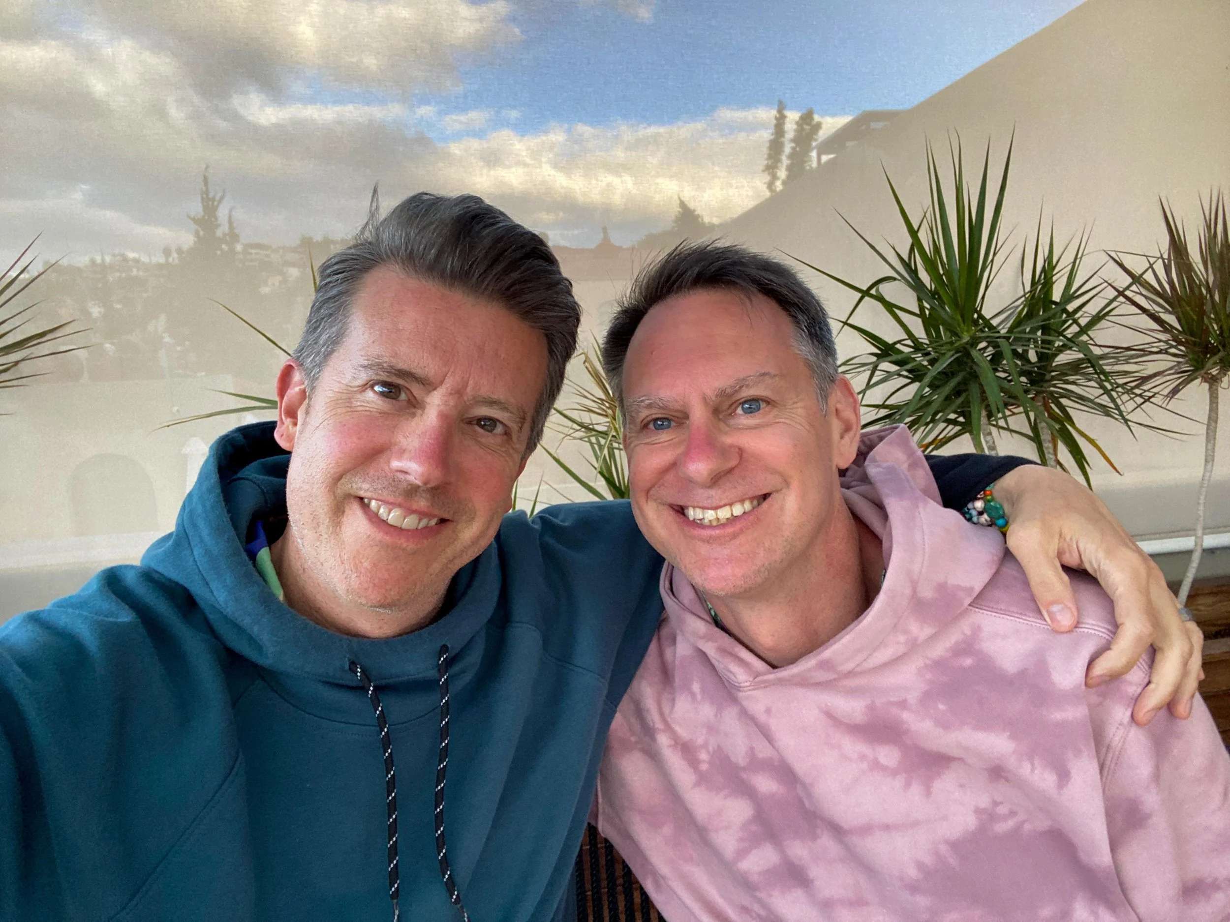 Gay couple on rooftop of Casa Hoyos