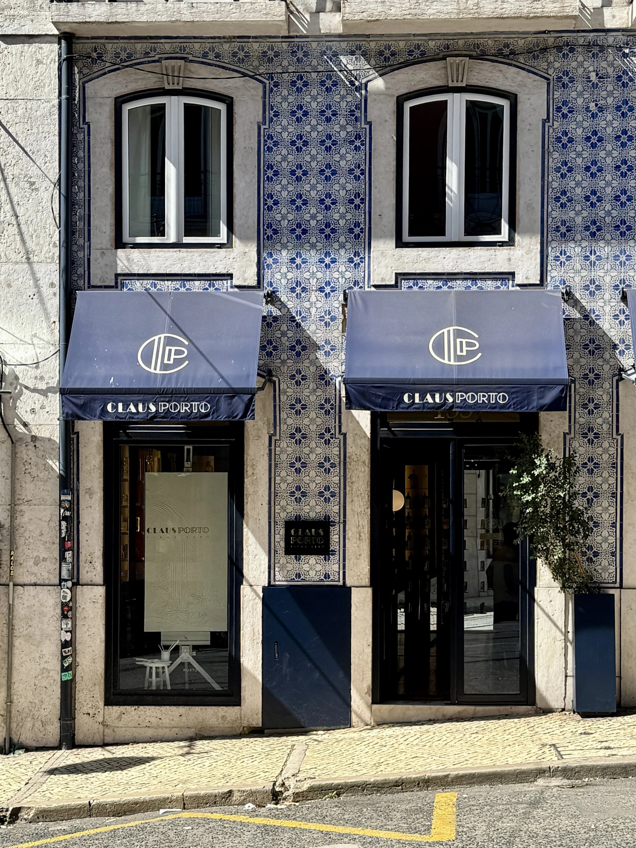 The blue and white tile-covered facade of Claus Porto in Lisbon, Portugal