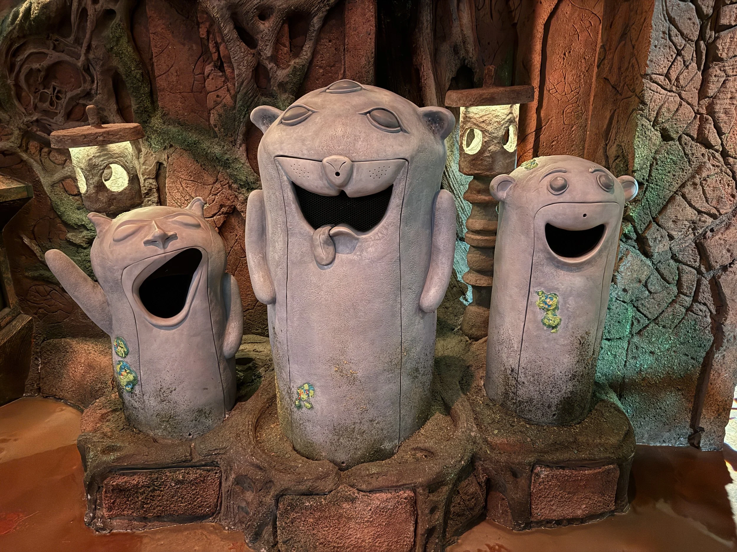 A trio of cute open-mouthed creatures at Meow Wolf Radio Tave in Houston, Texas