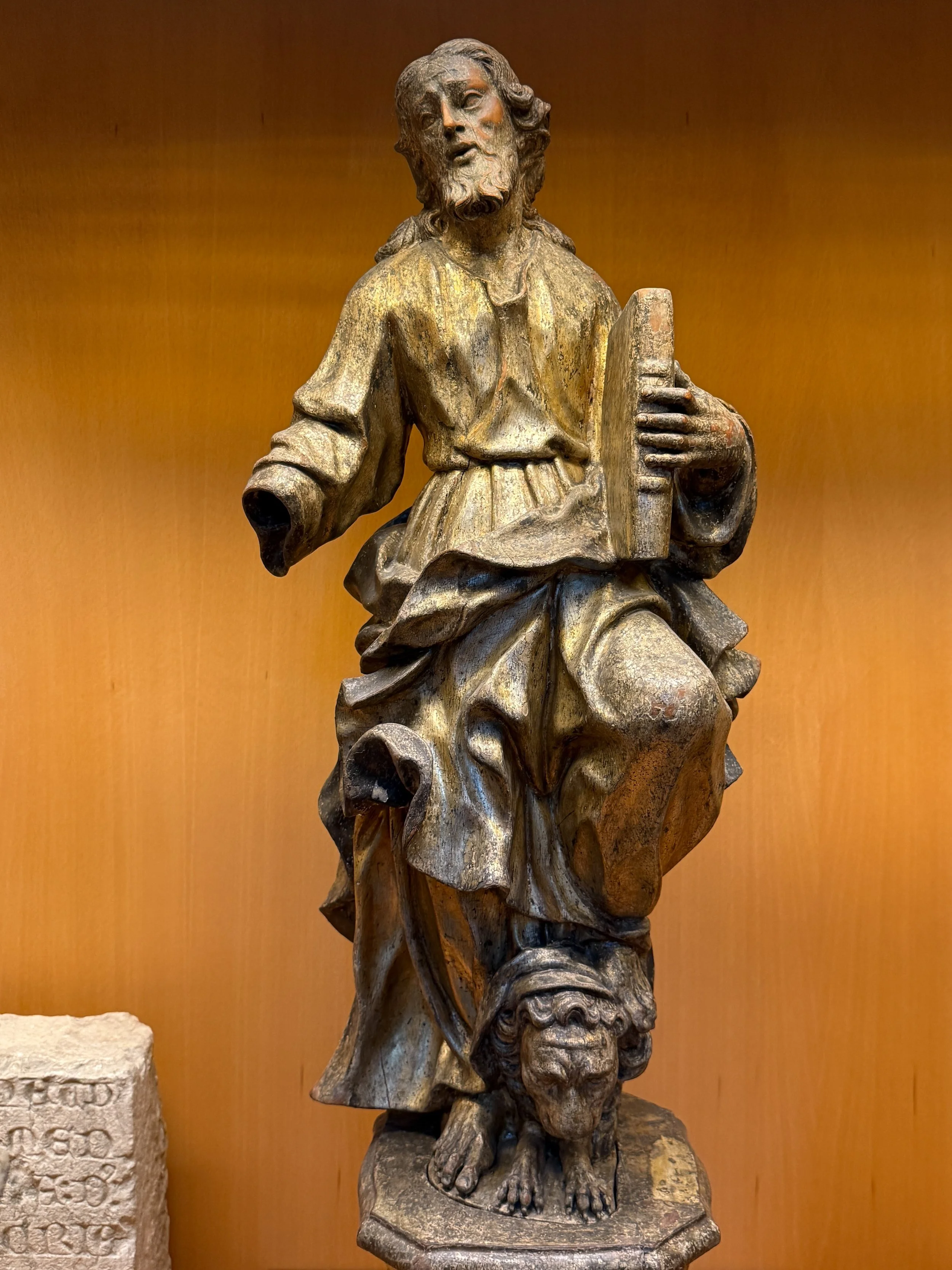 Sculpture of the Evangelist Matthew, holding a book with a lion at his feet, at the Carmo Convent in Lisbon