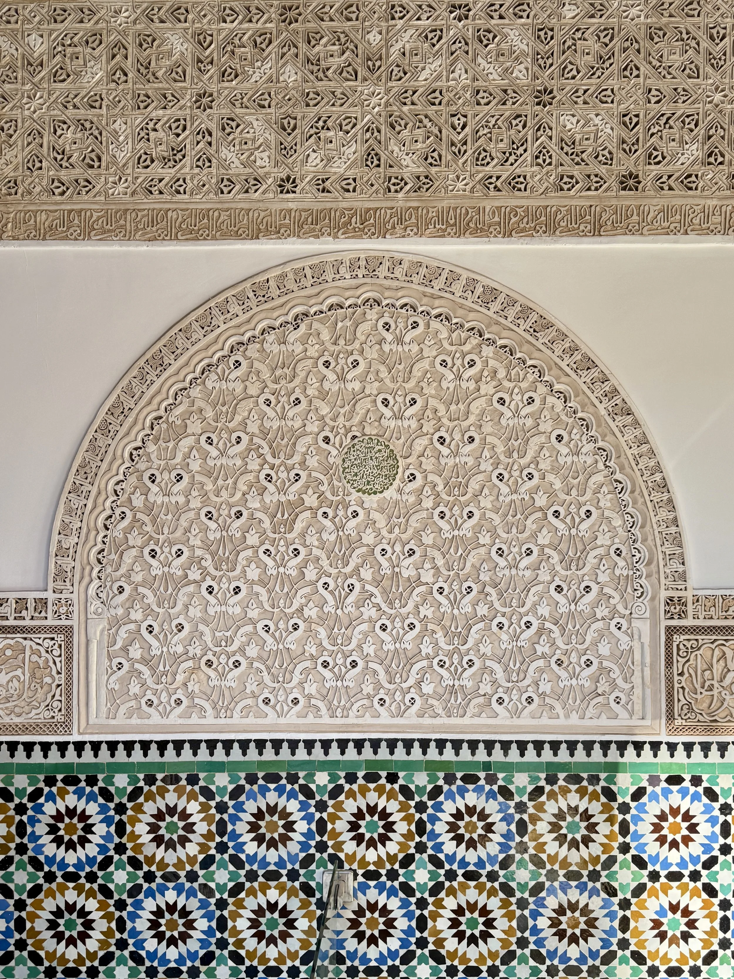 Beautiful carvings and tilework at Ben Youssef Madrasa in Marrakech