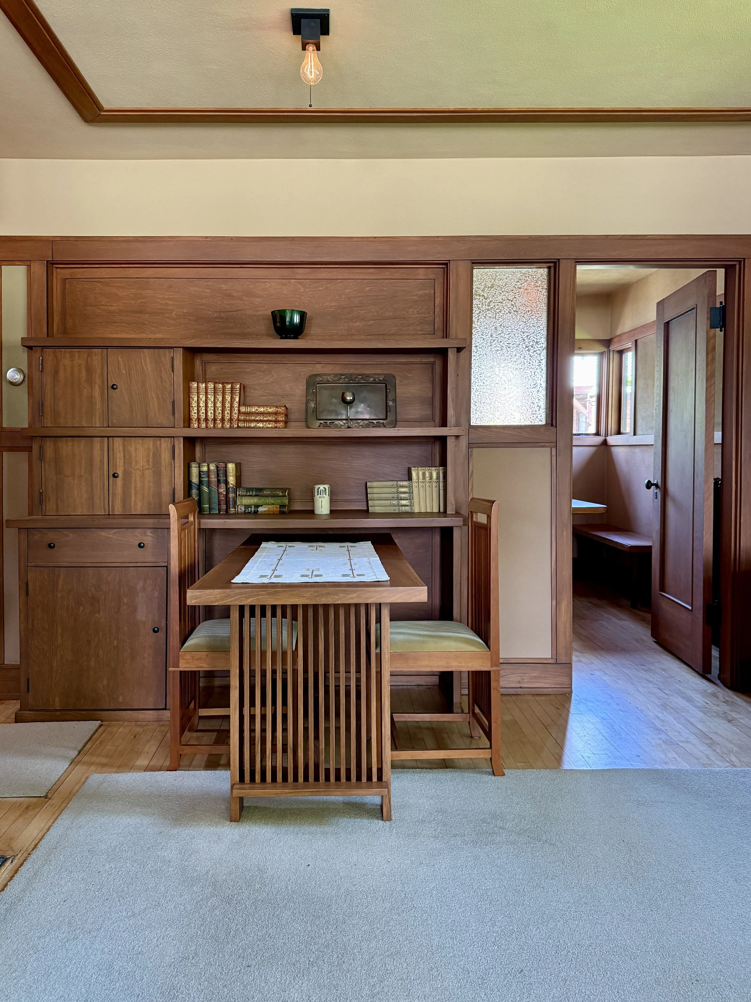 Built-in shelving and dining table in Model B1 of Frank Lloyd Wright's Burnham Block