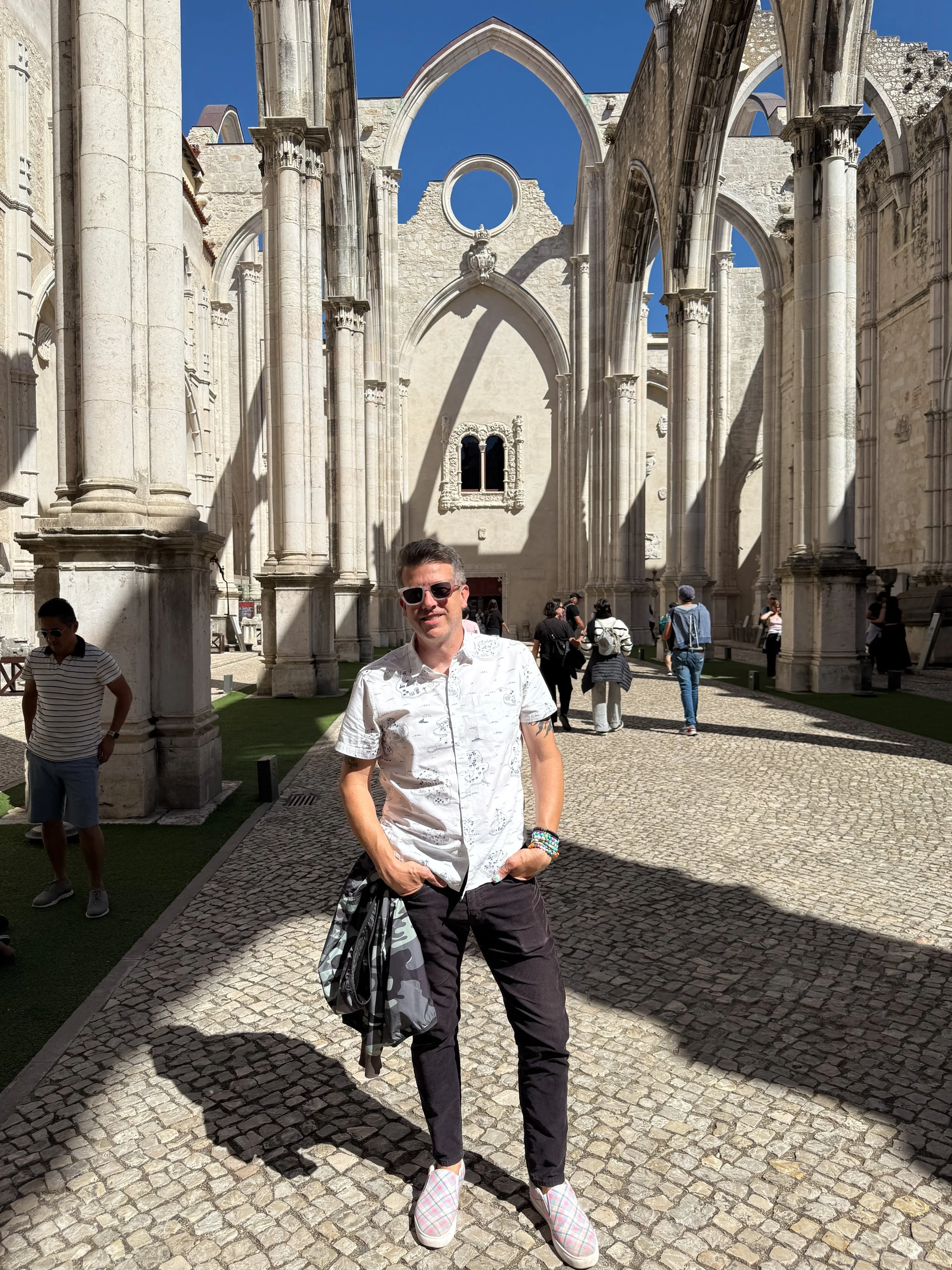 A man stands in the open-air Carmo Archaeological Museum in Lisbon