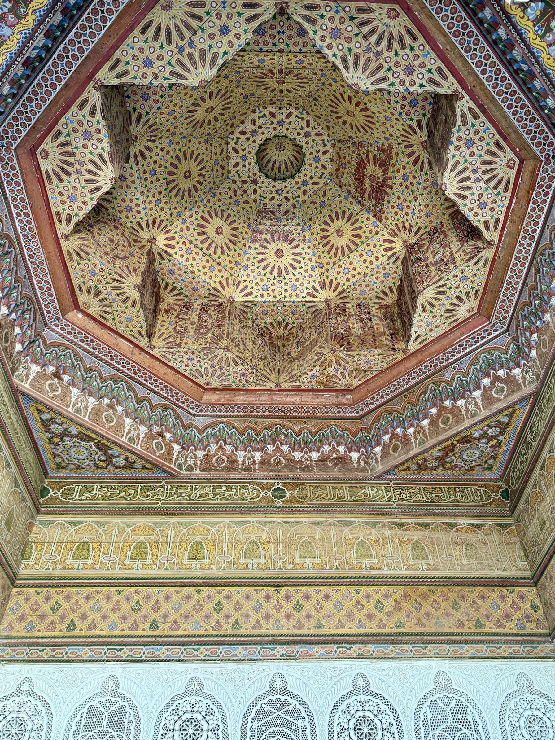 A star-shaped elaborately painted ceiling at Dar el Bacha in Marrakech, Morocco