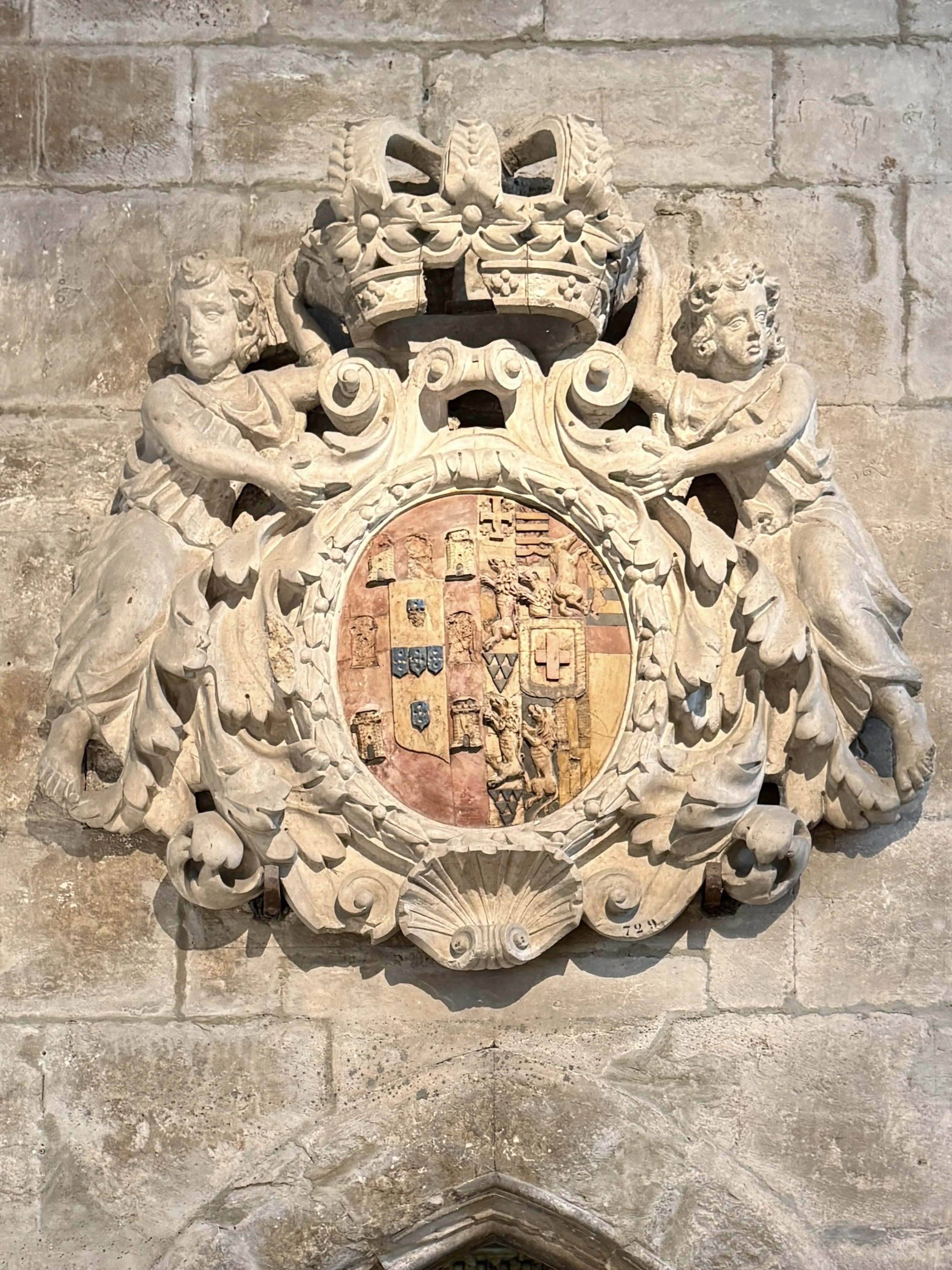 A 17th century shield bearing Queen Maria Francisca de Sabóia’s coat of arms hangs above the former sacristy doorway