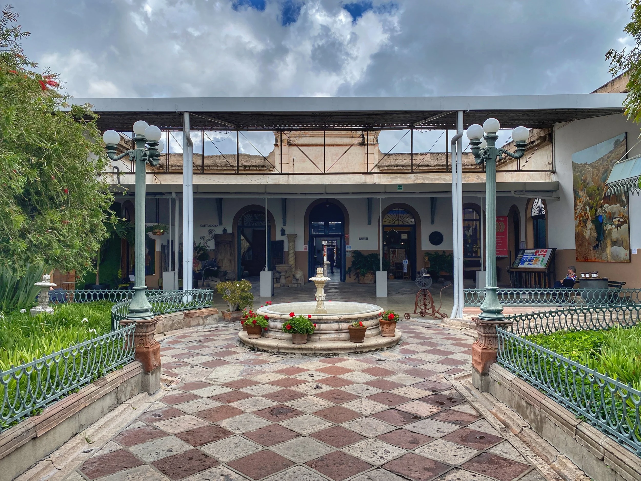 Checkered courtyard and fountain at old textile factory Fabrica la Aurora, which is now an arts center