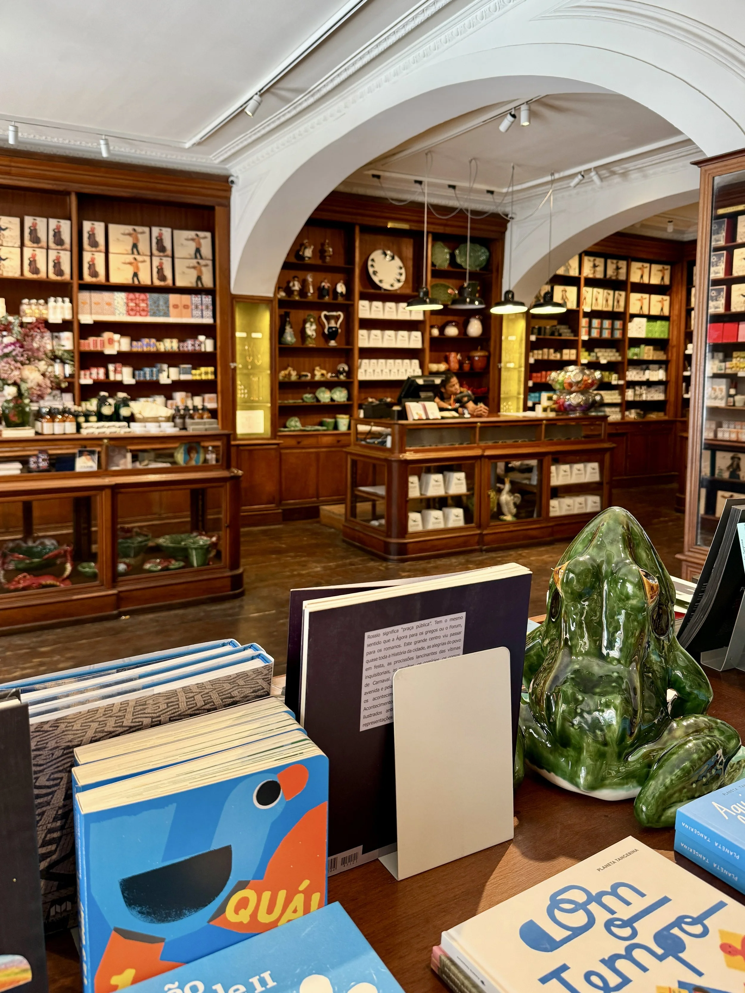 Books and a frog ceramic for sale at A Vida Portuguesa In Lisbon, Portugal