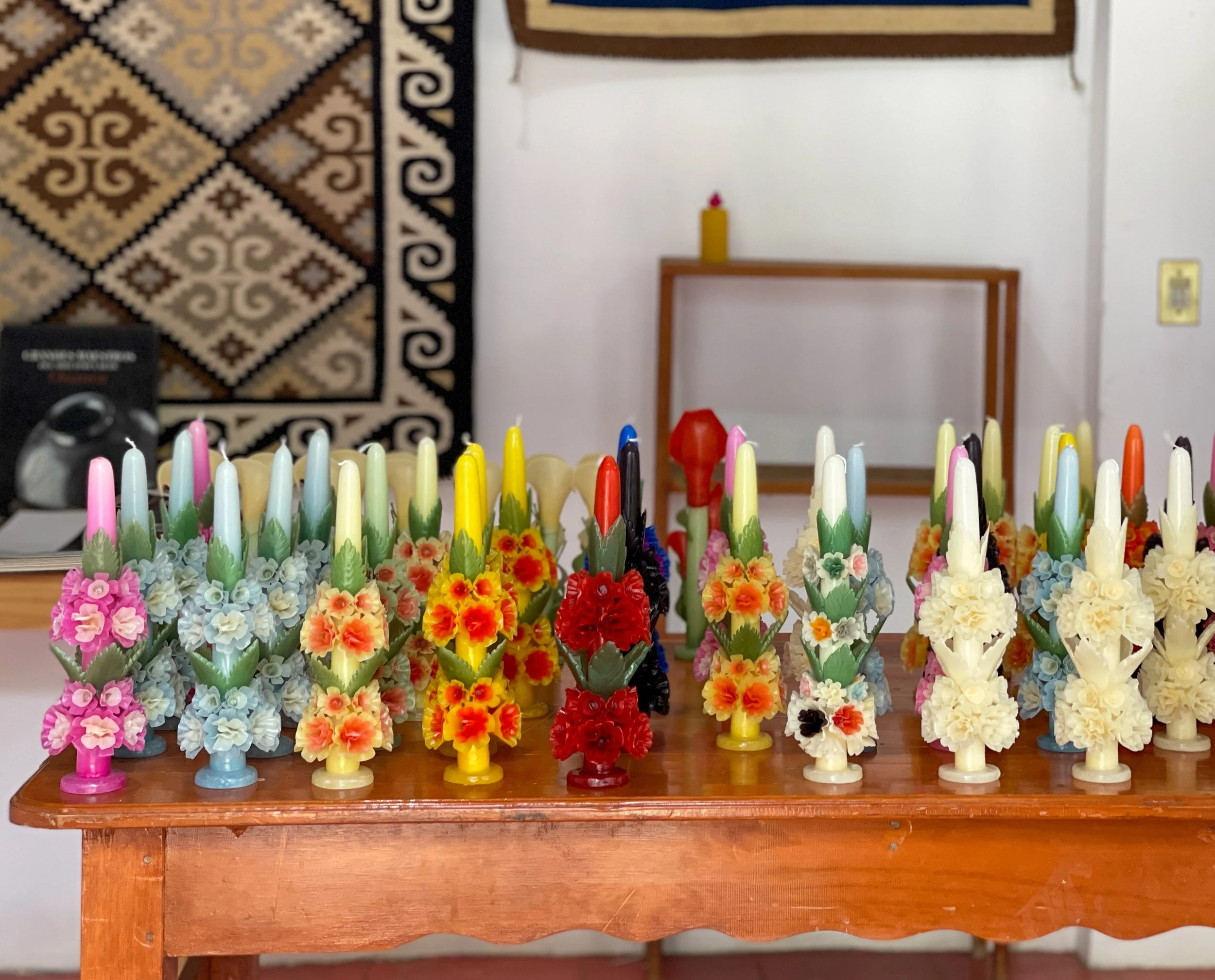 Ornate flower-shaped colorful candles for sale at Casa Viviana in Teotitlán del Valle