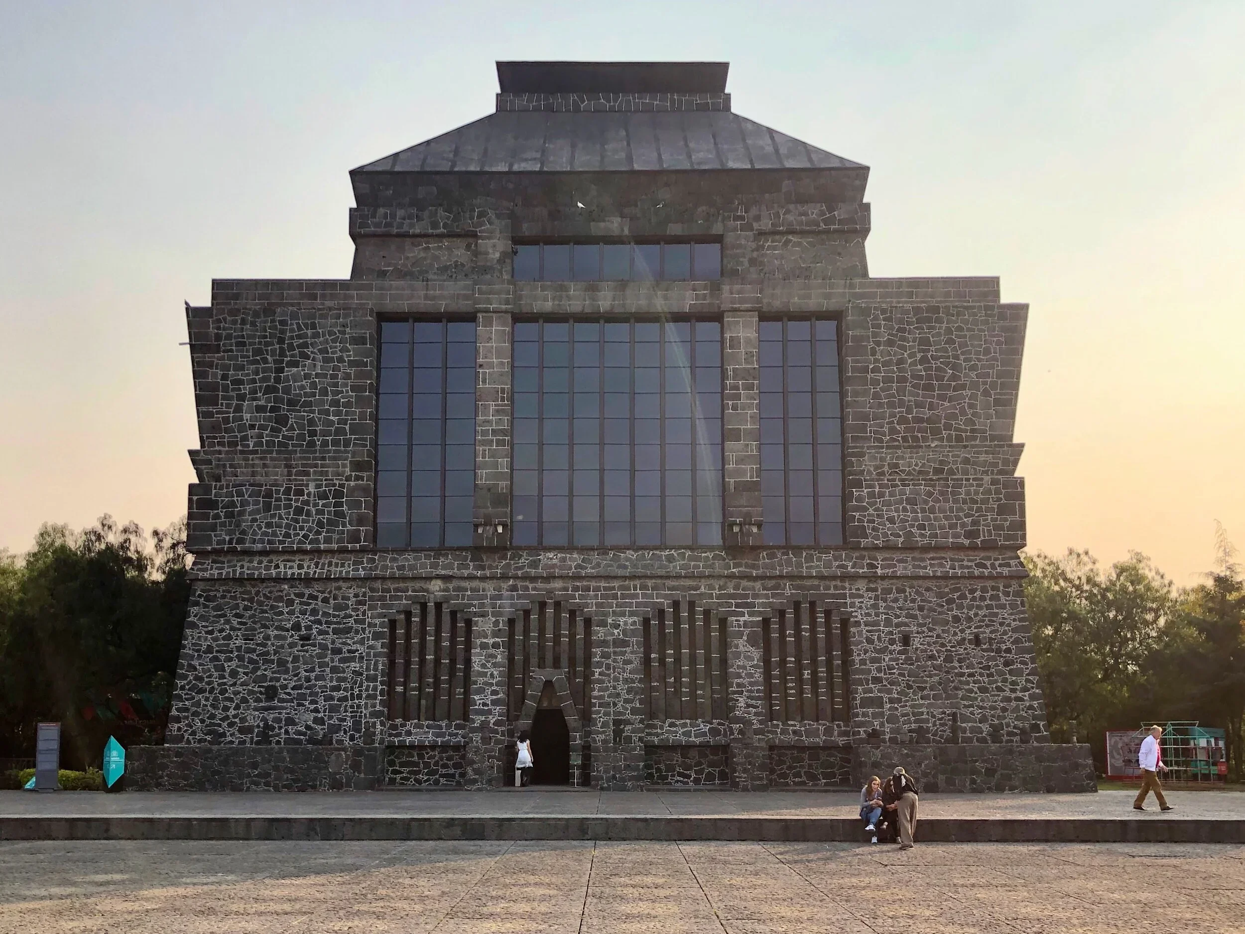 The stone exterior of Museo Anahuacalli at sunset