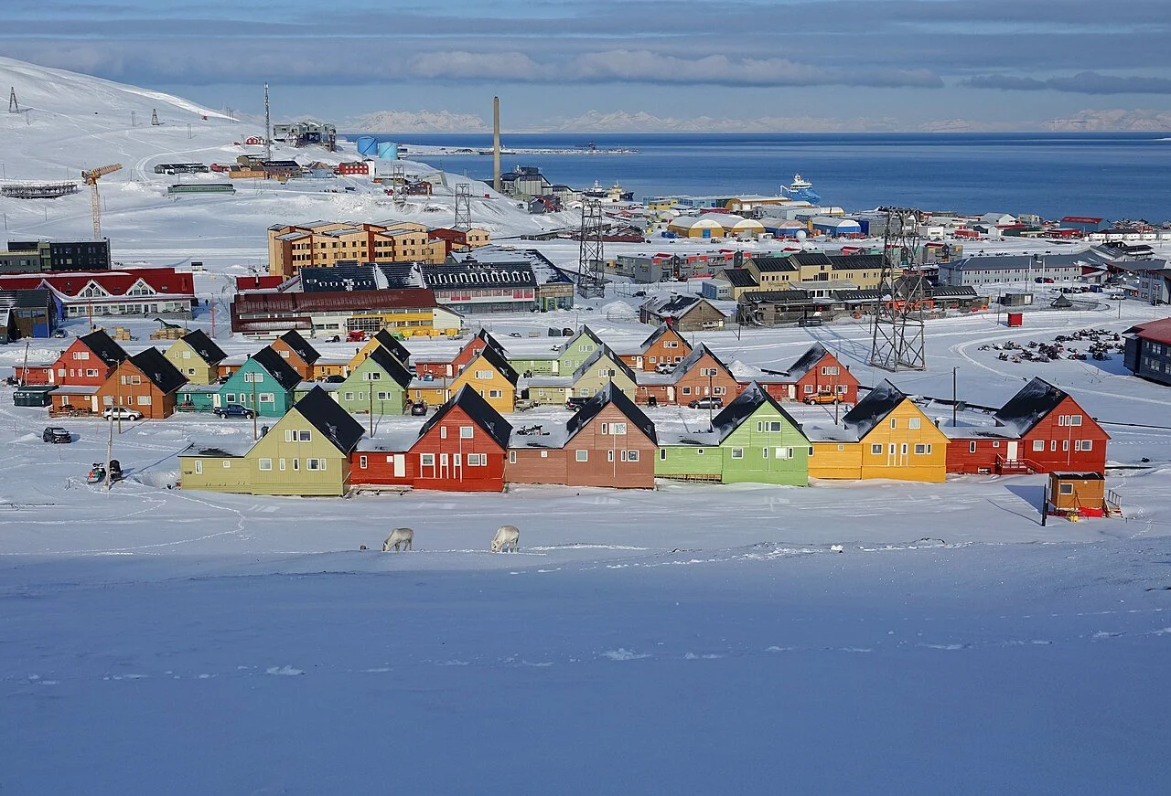 The colorful buildings of Longyearbyen, Norway in Svalbard in the snow