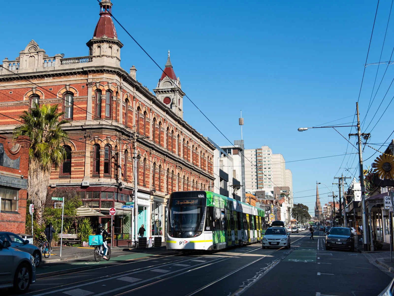 A street with bus and historic building in Fitzroy, Melbourne, Australia