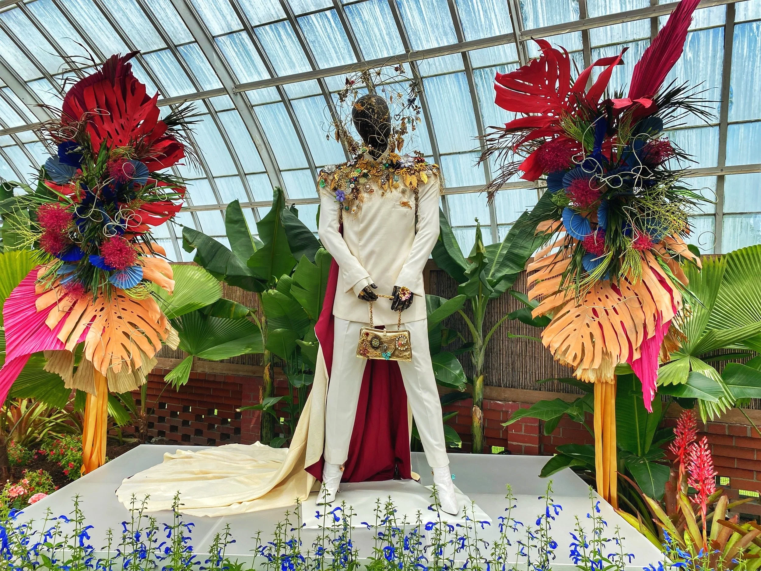 Mannequin wearing funky white suit with metal accents at the Phipps