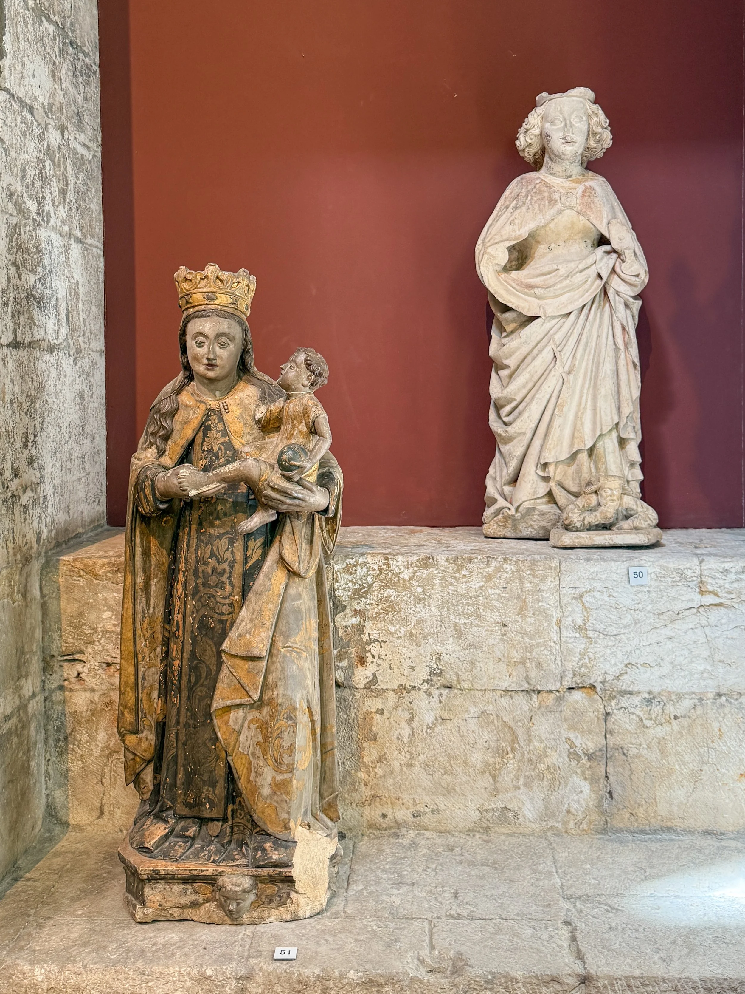 Our Lady of Mount Carmel, for whom the convent was named, cradles the Christ Child beside a weathered Saint Catherine of Alexandria