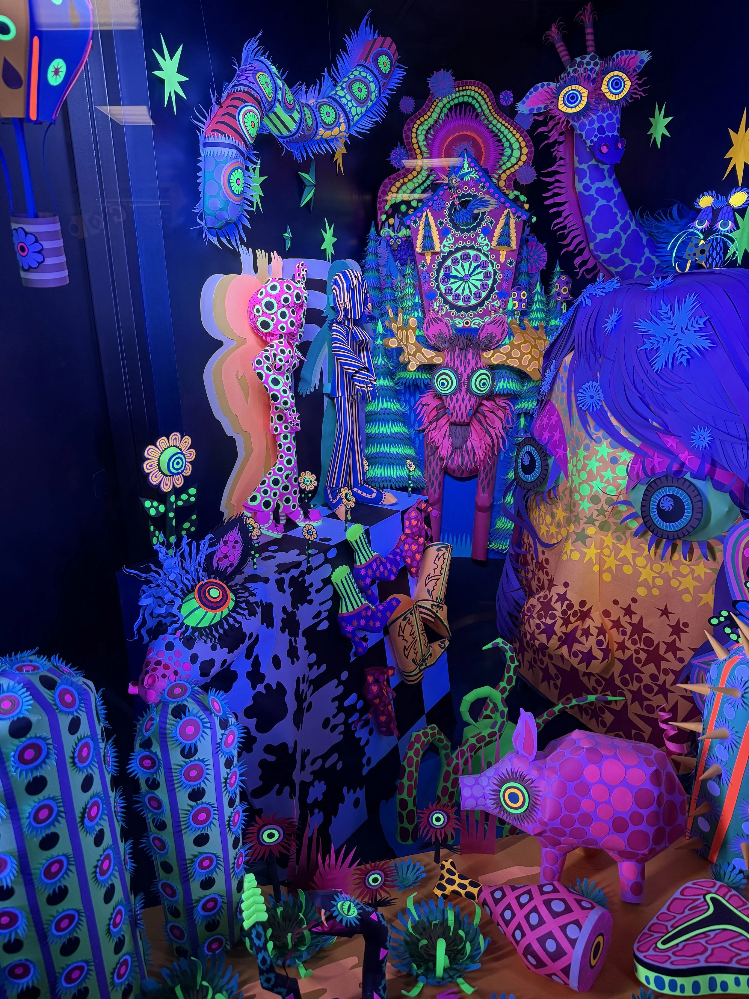 Whimsical neon-lit creatures at Meow Wolf Radio Tave in Houston, Texas