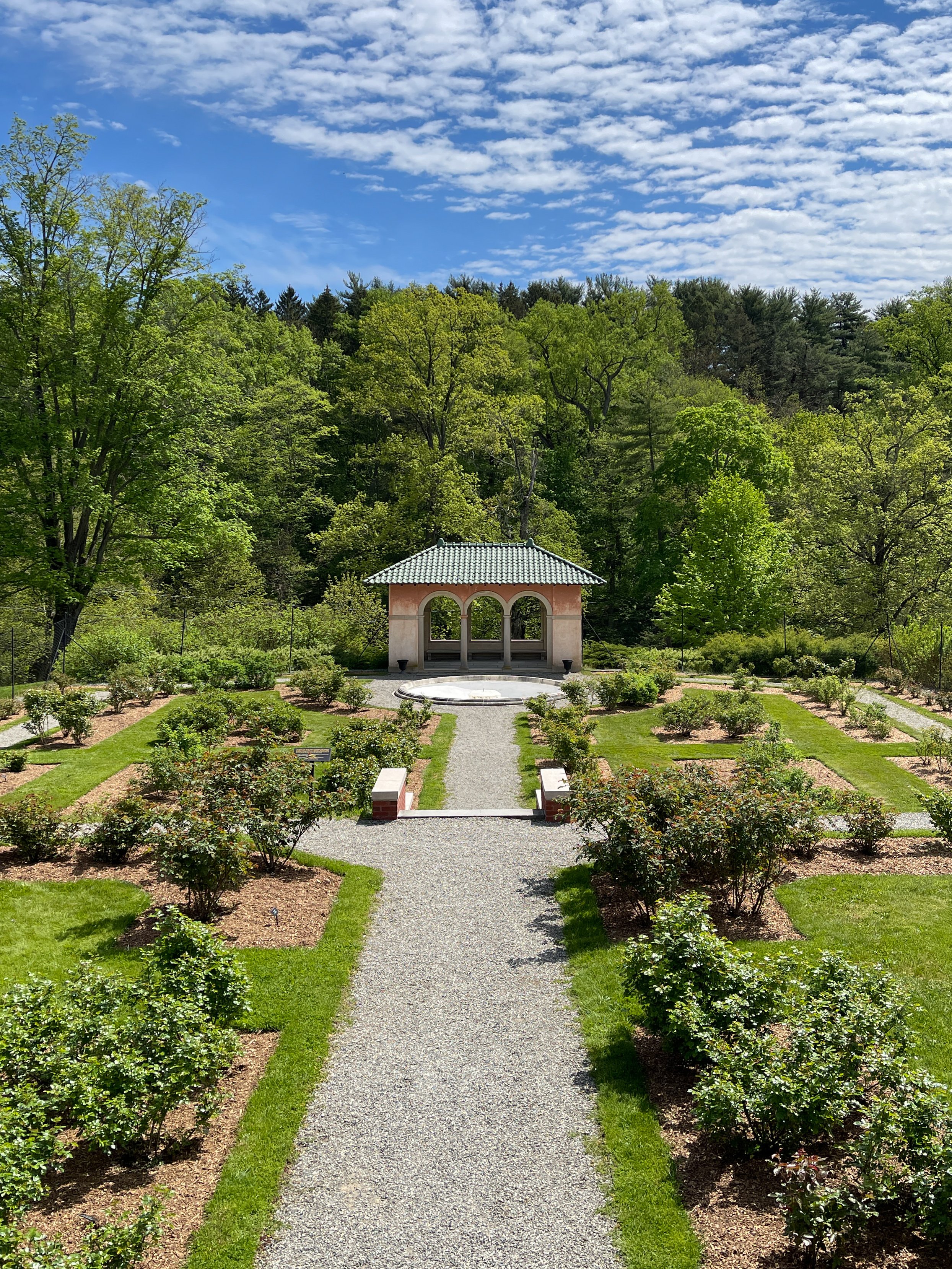 Gravel pathway leading through the rose garden at Vanderbilt Mansion