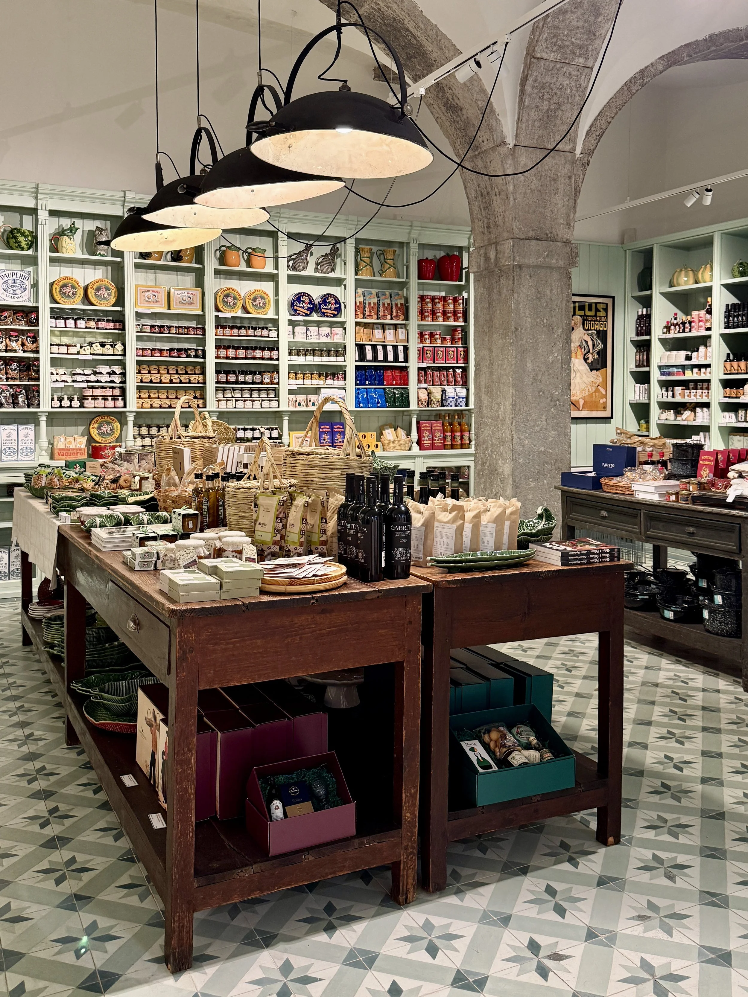 An extensive assortment of artisanal olive oils, wines, liqueurs, jams, cookies and traditional pantry items from across Portugal in the market section of A Vida Portuguesa in Lisbon