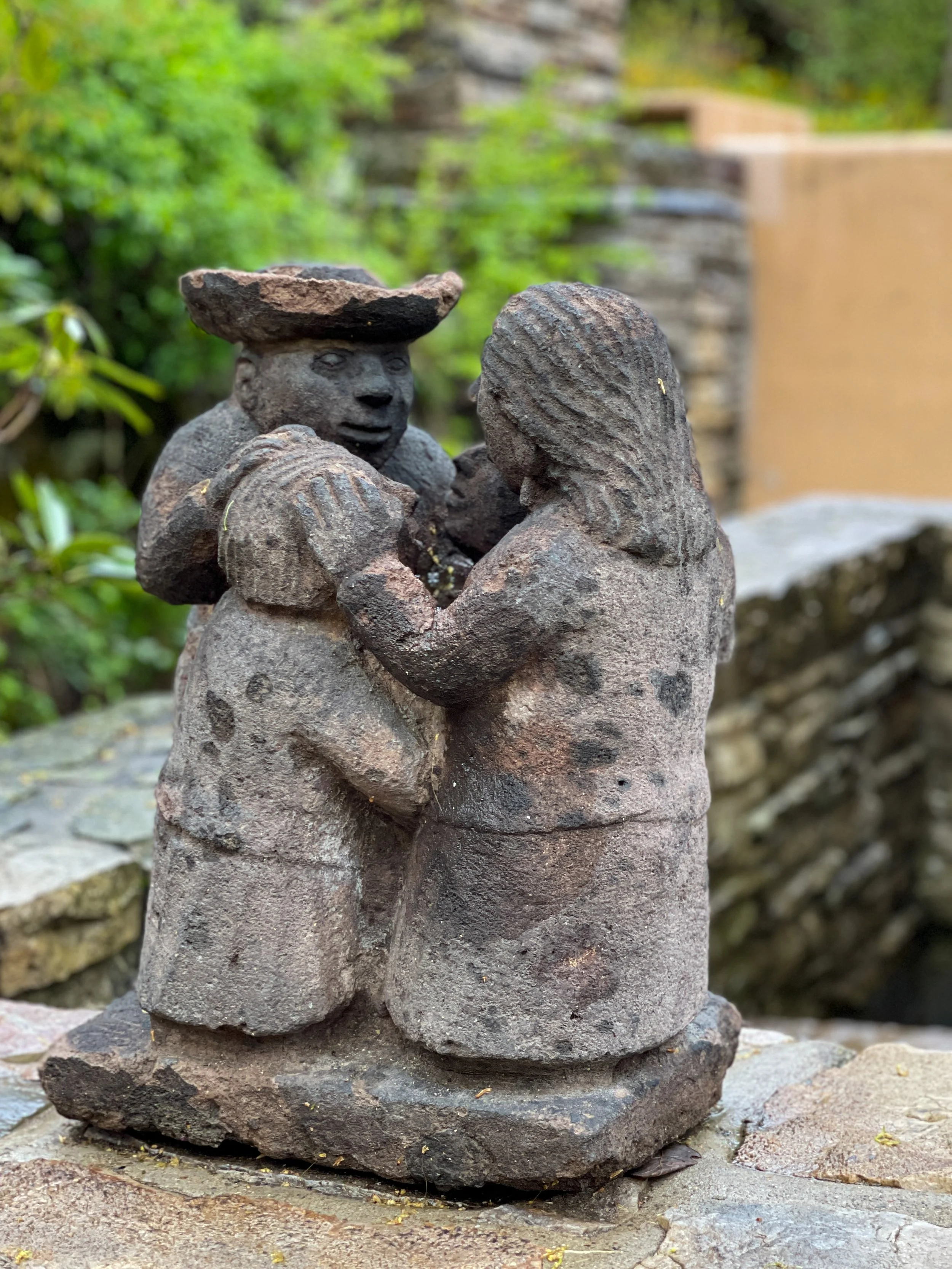 Small sculpture of four people in a circle by Mardonio Magaña at Fallingwater