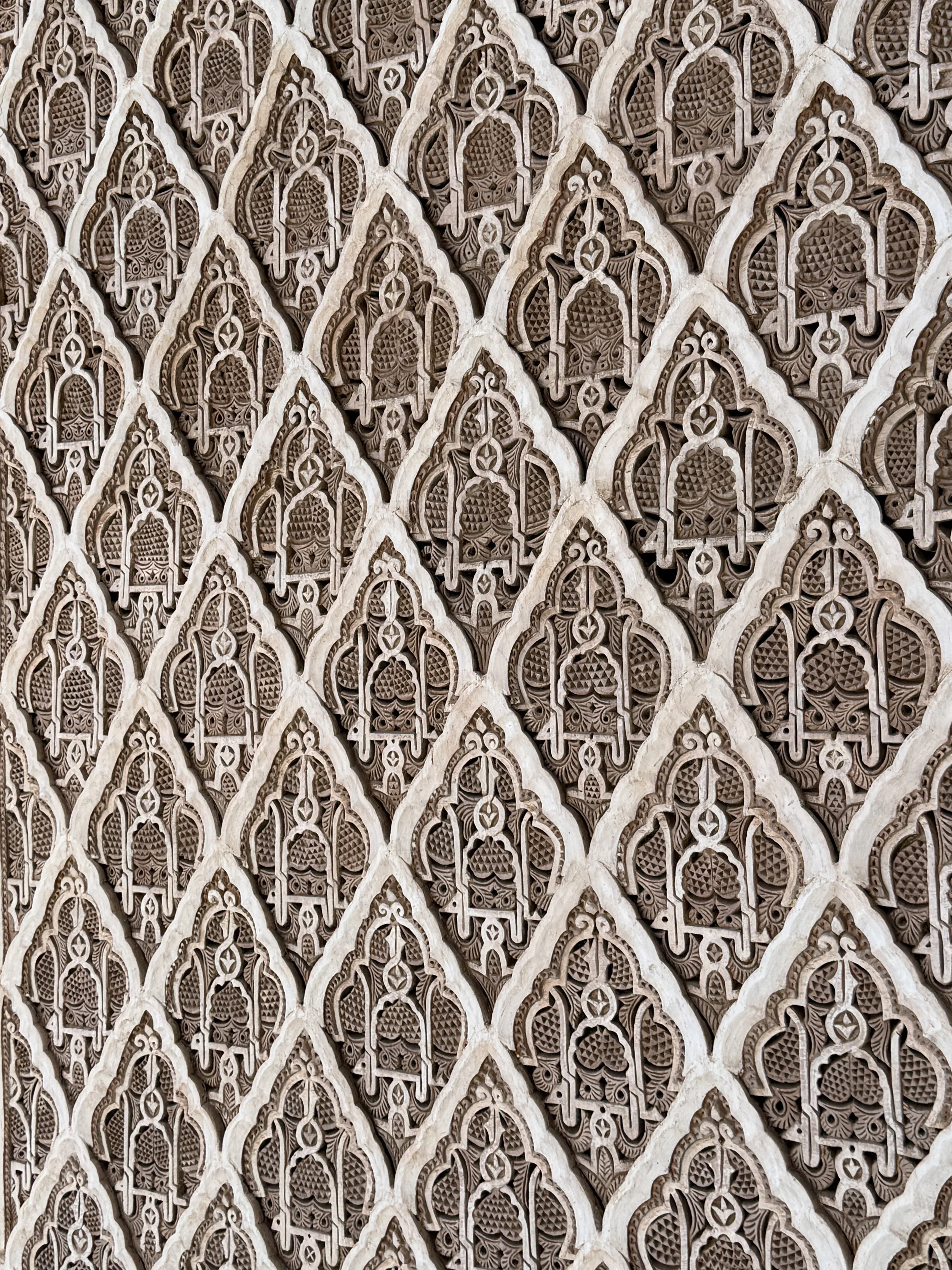 Amazingly detailed repeating patterns on the plaster walls of Ben Youssef Madrasa