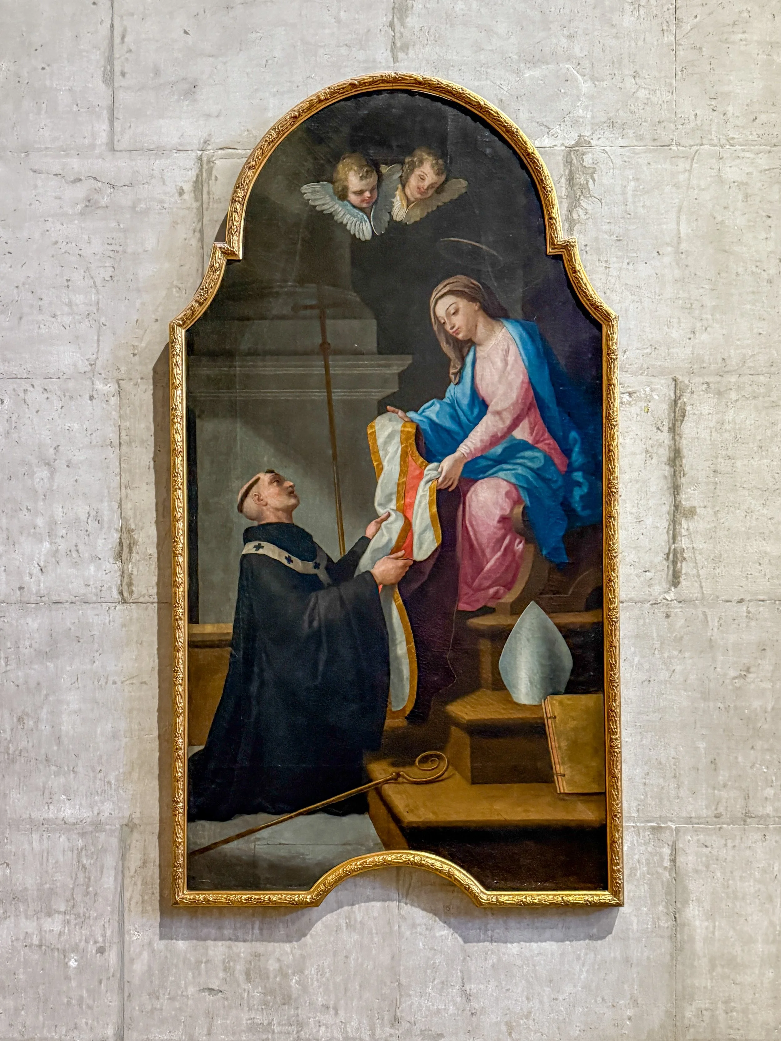 At Lisbon Cathedral, the Chapel of Idephonsus holds a painting Saint Ildephonsus receiving a chasuble, the outermost priestly vestment worn during mass, from the Virgin Mary, a gift honoring his defense of her perpetual virginity